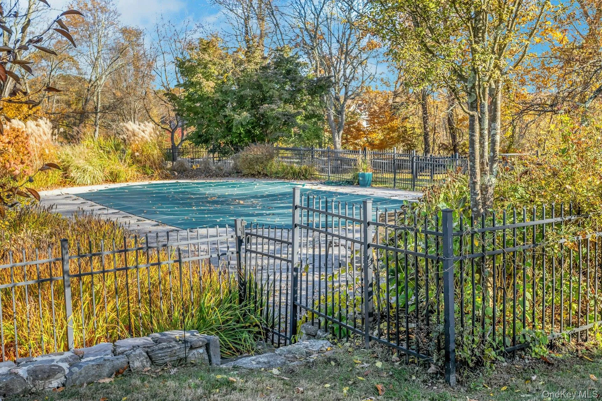 View of swimming pool featuring a patio area View of swimming pool featuring a patio area