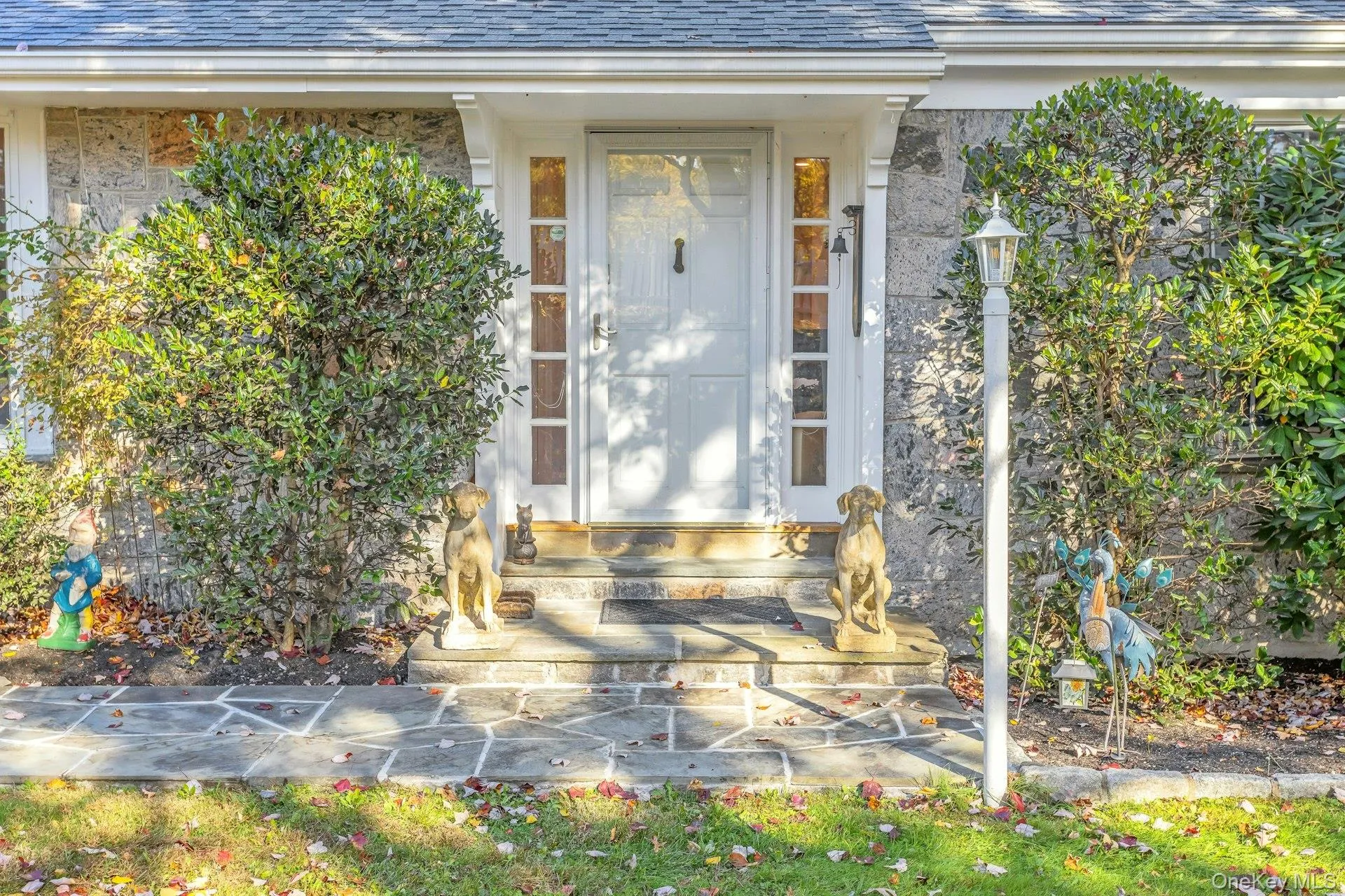 Property entrance featuring roof with shingles Property entrance featuring roof with shingles