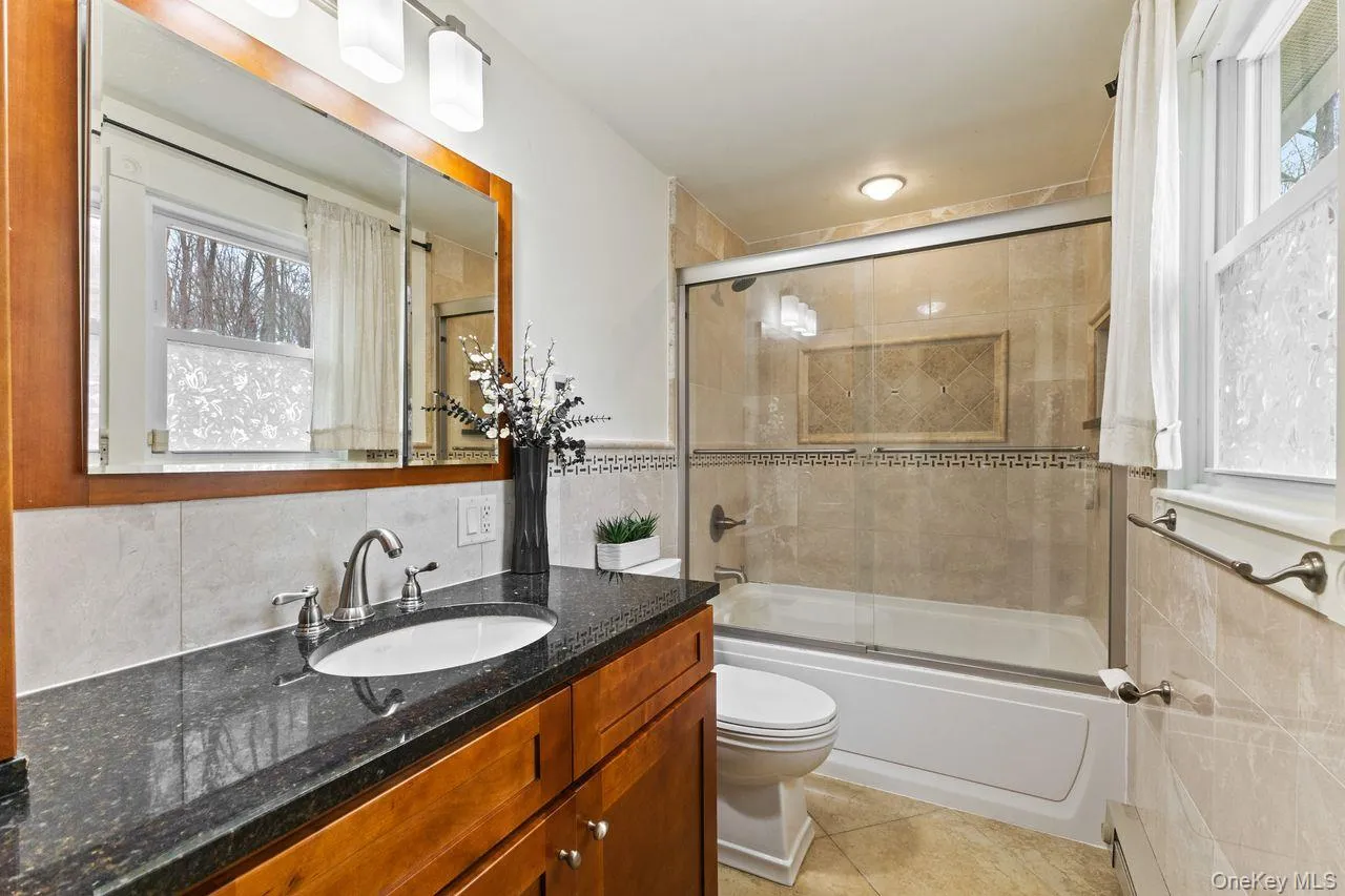 Updated primary bathroom with heated floors. Updated primary bathroom with heated floors.