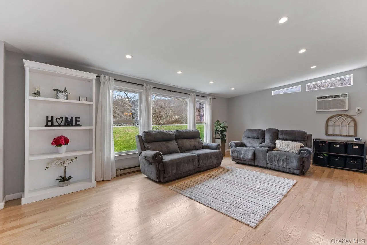 Large living room with plenty of natural light. Large living room with plenty of natural light.