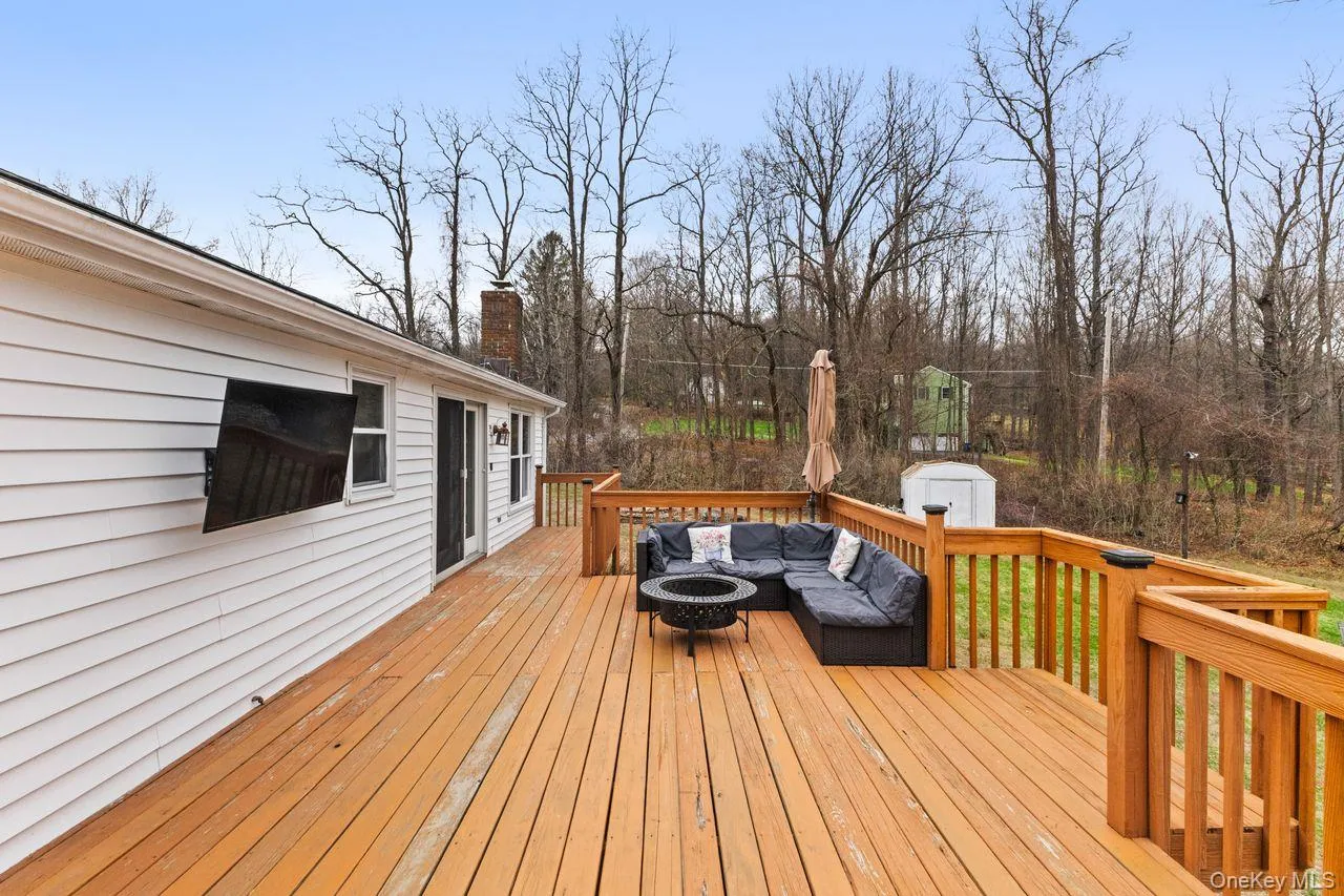 Large deck off main floor overlooking yard. Large deck off main floor overlooking yard.