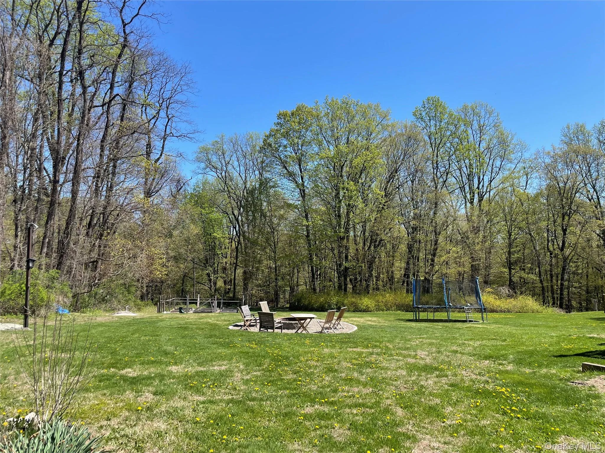 Yard with firepit. Yard with firepit.