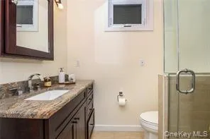 Full bathroom with vanity and a shower stall Full bathroom with vanity and a shower stall