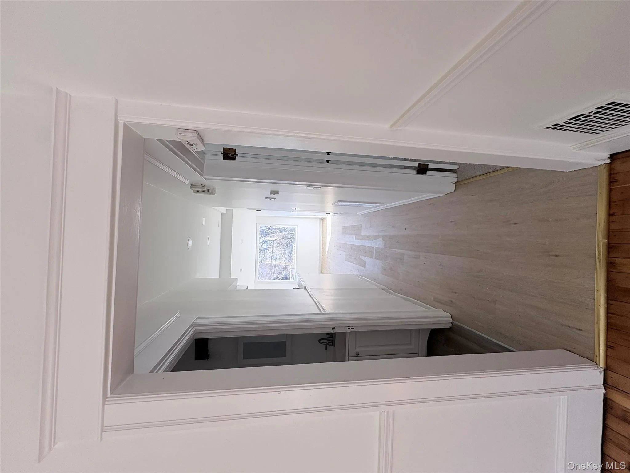 Hallway with light vinyl flooring Hallway with light vinyl flooring