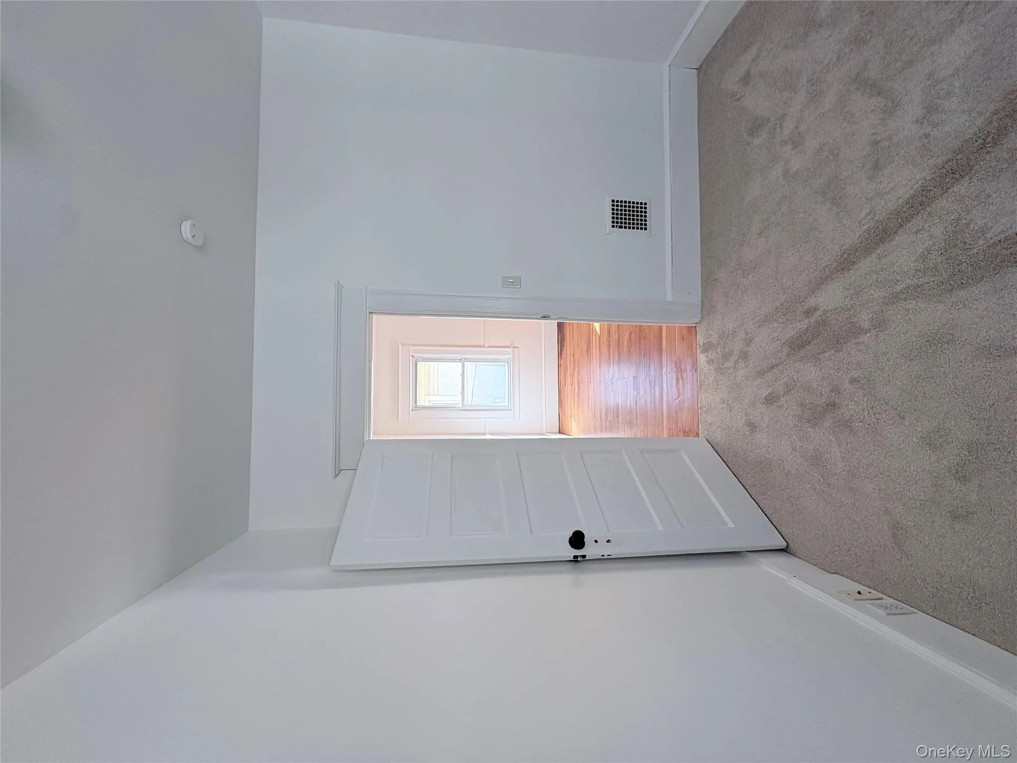 Bedroom 1 with craftsman baseboards and light carpet Bedroom 1 with craftsman baseboards and light carpet