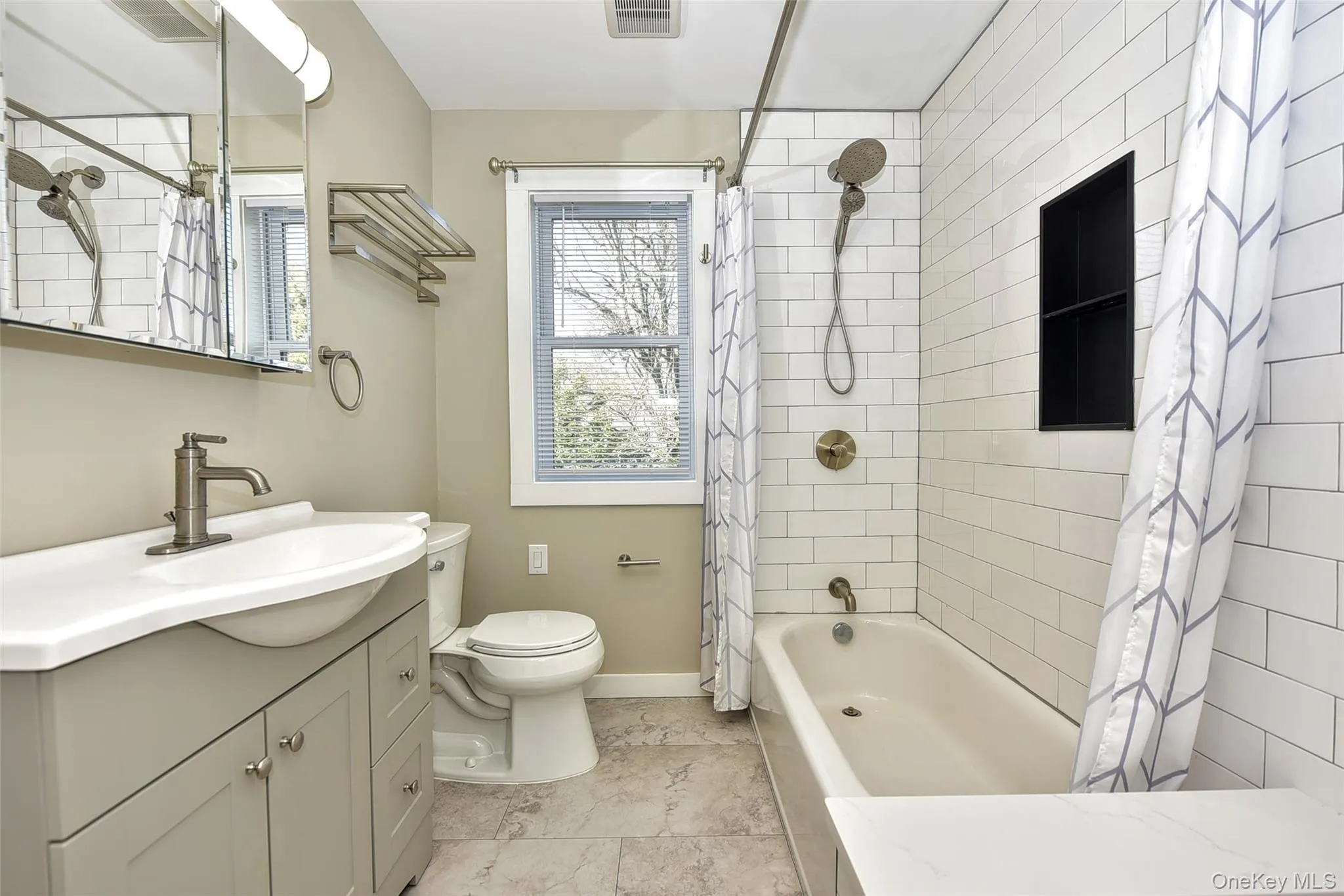 Modern vanity and shower over tiled tub Modern vanity and shower over tiled tub