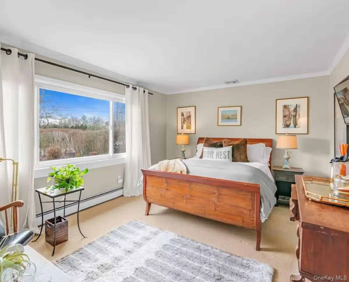Light-filled guest bedroom with garden views Light-filled guest bedroom with garden views