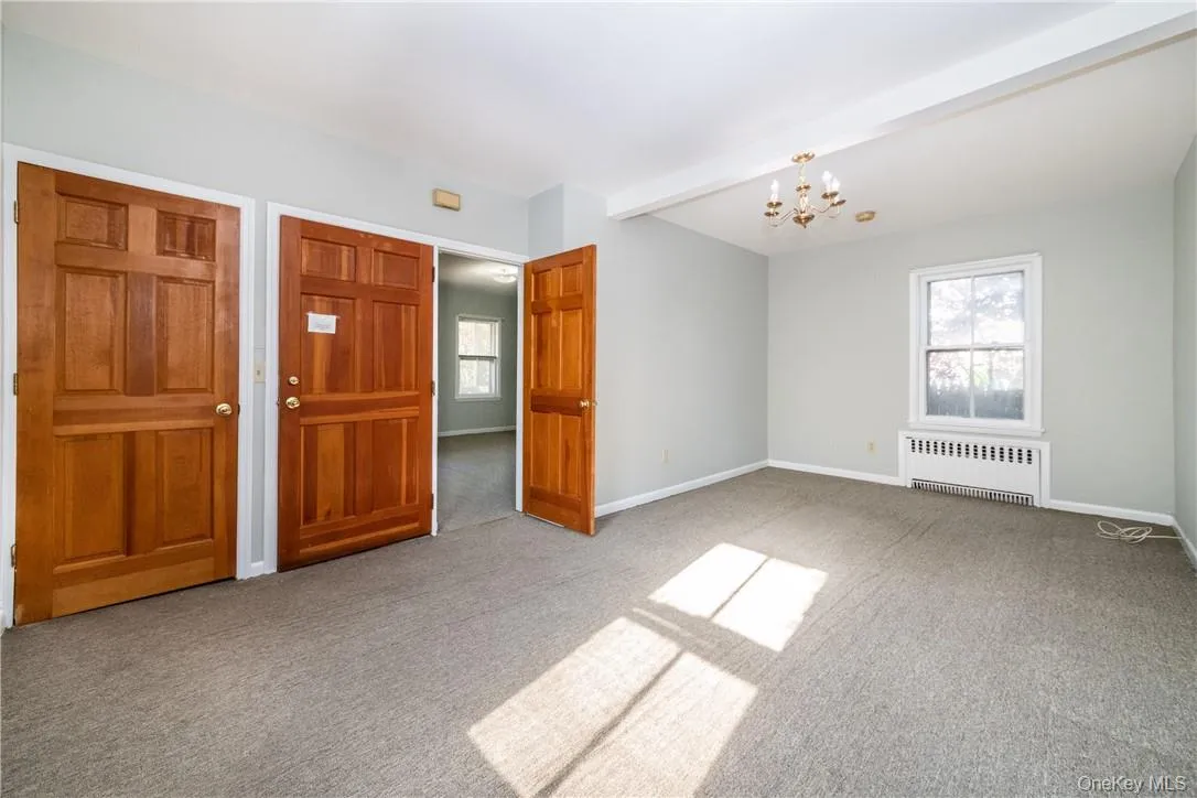 Living room with entrance door and bedroom Living room with entrance door and bedroom