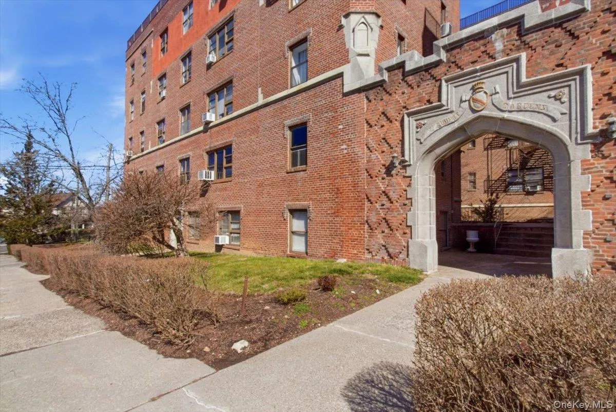 View of apartment building / complex featuring cooling unit View of apartment building / complex featuring cooling unit