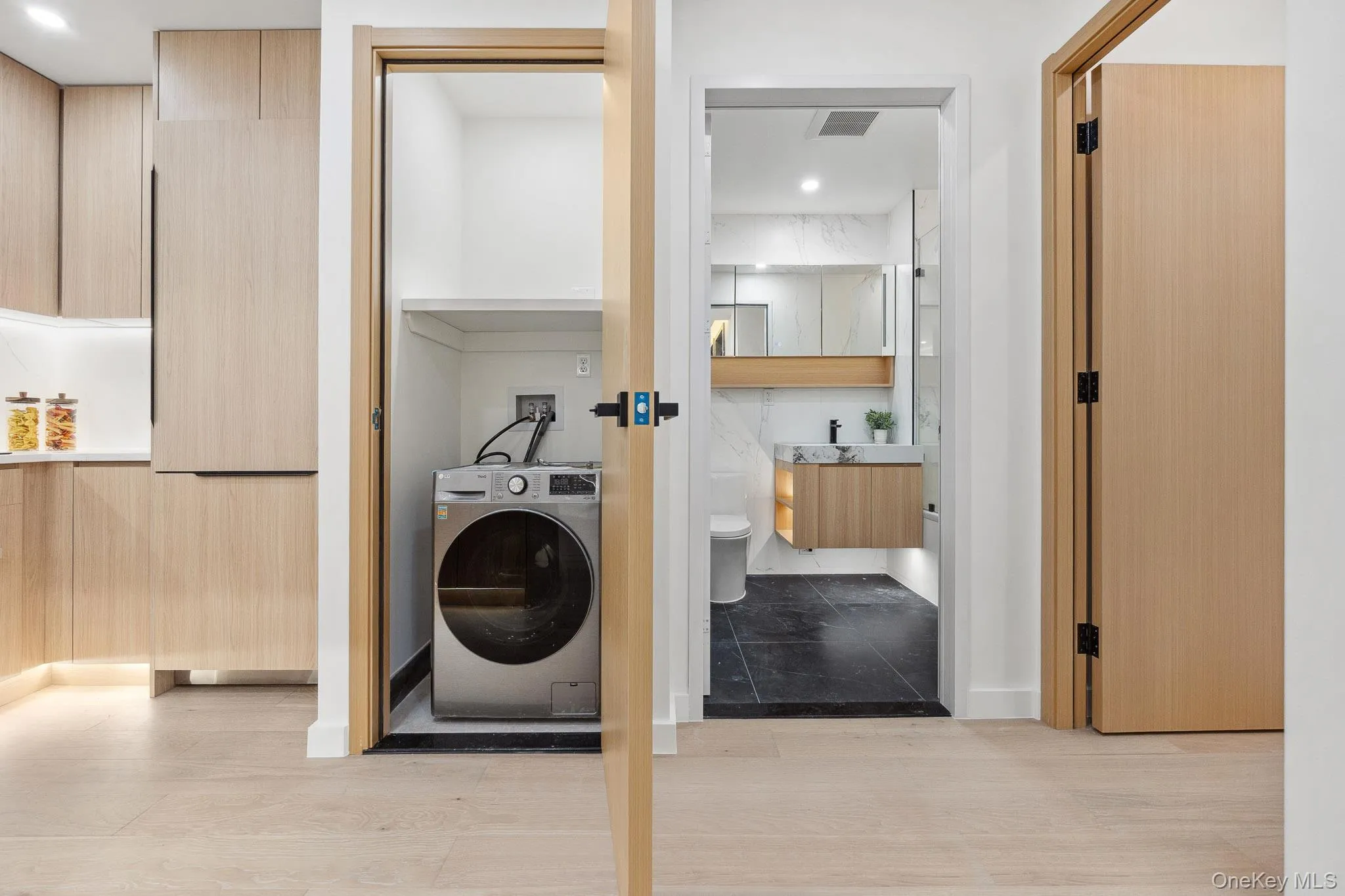 Laundry room featuring washer / dryer and baseboards Laundry room featuring washer / dryer and baseboards