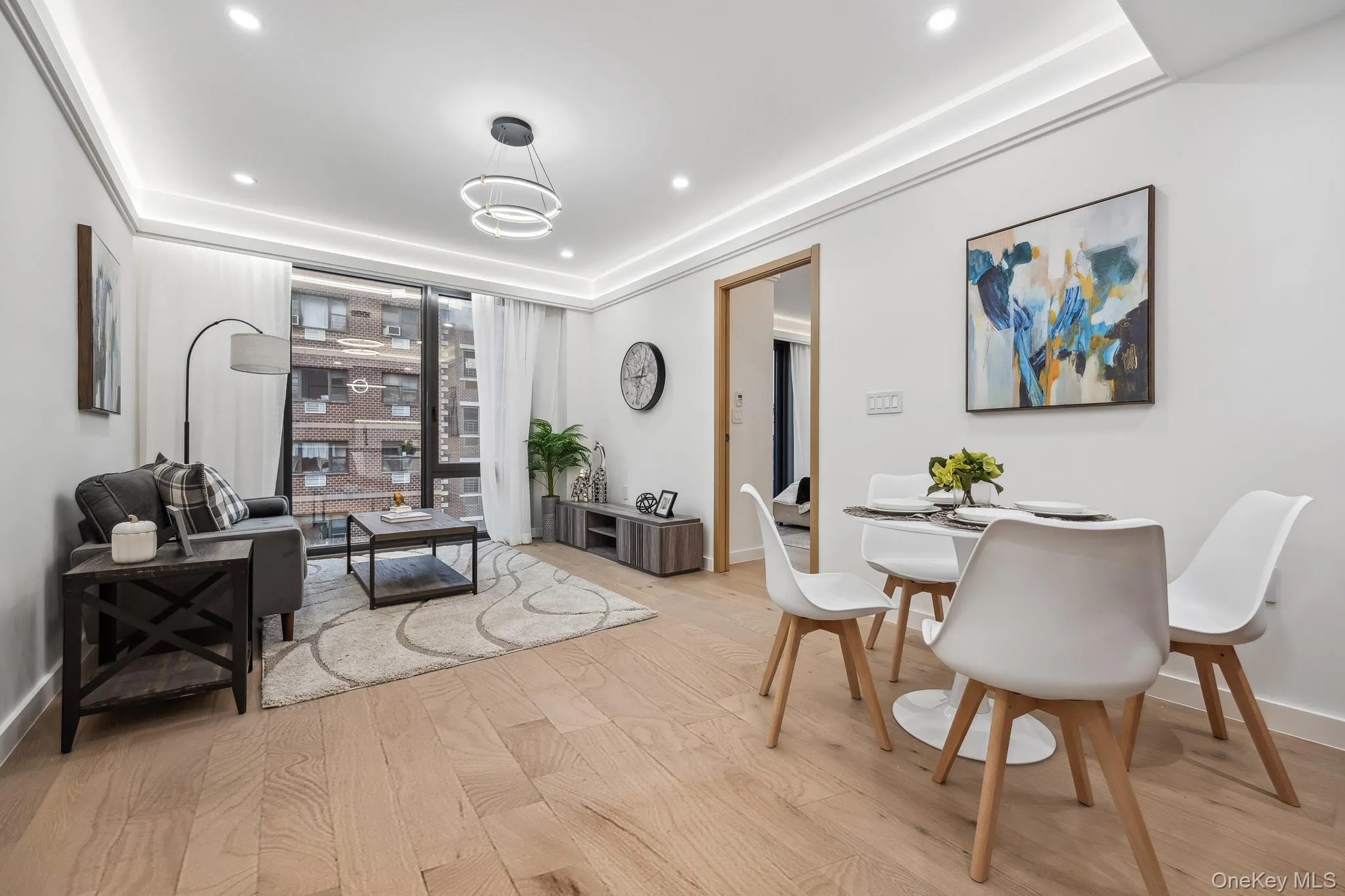 Dining area featuring light wood-style flooring, recessed lighting, a wall of windows, and baseboards Dining area featuring light wood-style flooring, recessed lighting, a wall of windows, and baseboards