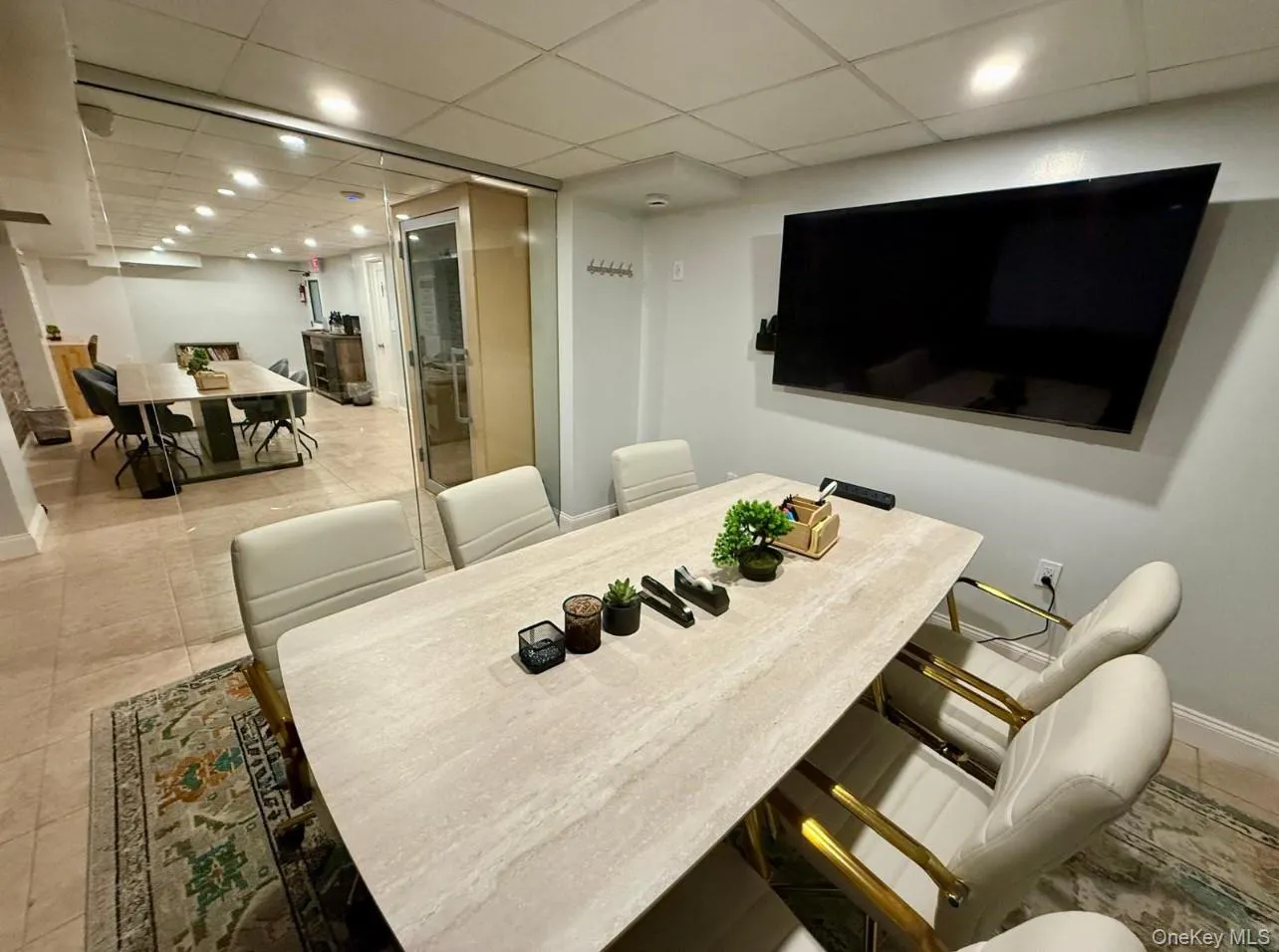Dining area featuring a paneled ceiling, light tile patterned floors, and recessed lighting Dining area featuring a paneled ceiling, light tile patterned floors, and recessed lighting