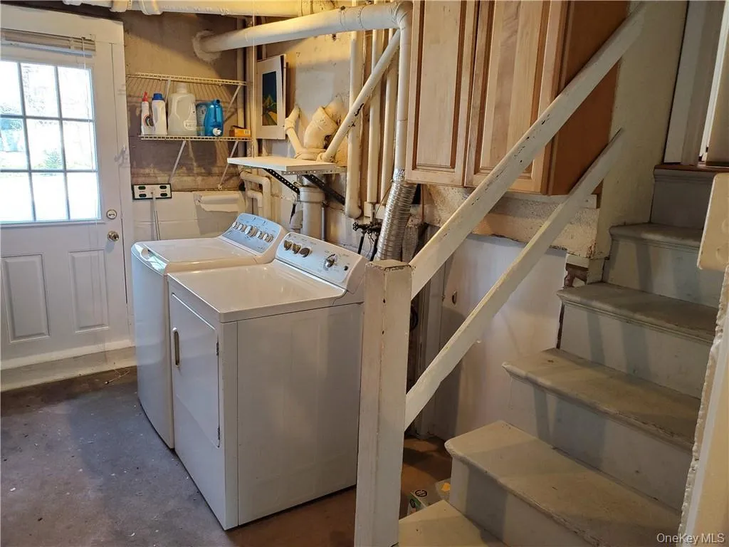 Laundry room with laundry area and washing machine and clothes dryer Laundry room with laundry area and washing machine and clothes dryer