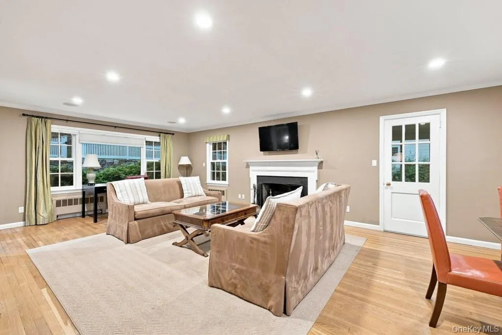 Living Room with Wood Burning Fireplace & Gaming Area Living Room with Wood Burning Fireplace & Gaming Area