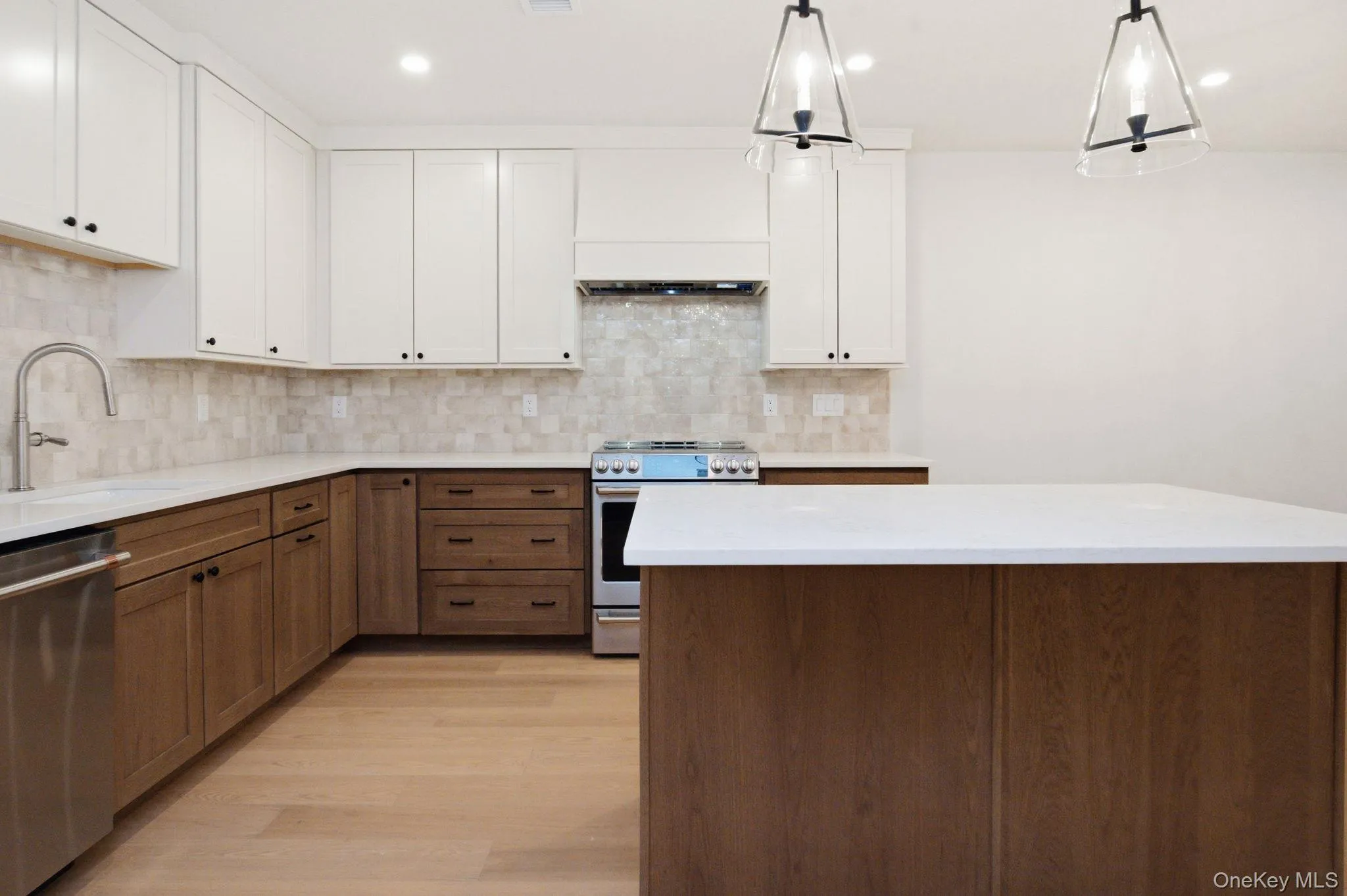 Spacious kitchen anchored by an oversized island, offering additional seating, storage, and a natural gathering point within the home. Spacious kitchen anchored by an oversized island, offering additional seating, storage, and a natural gathering point within the home.