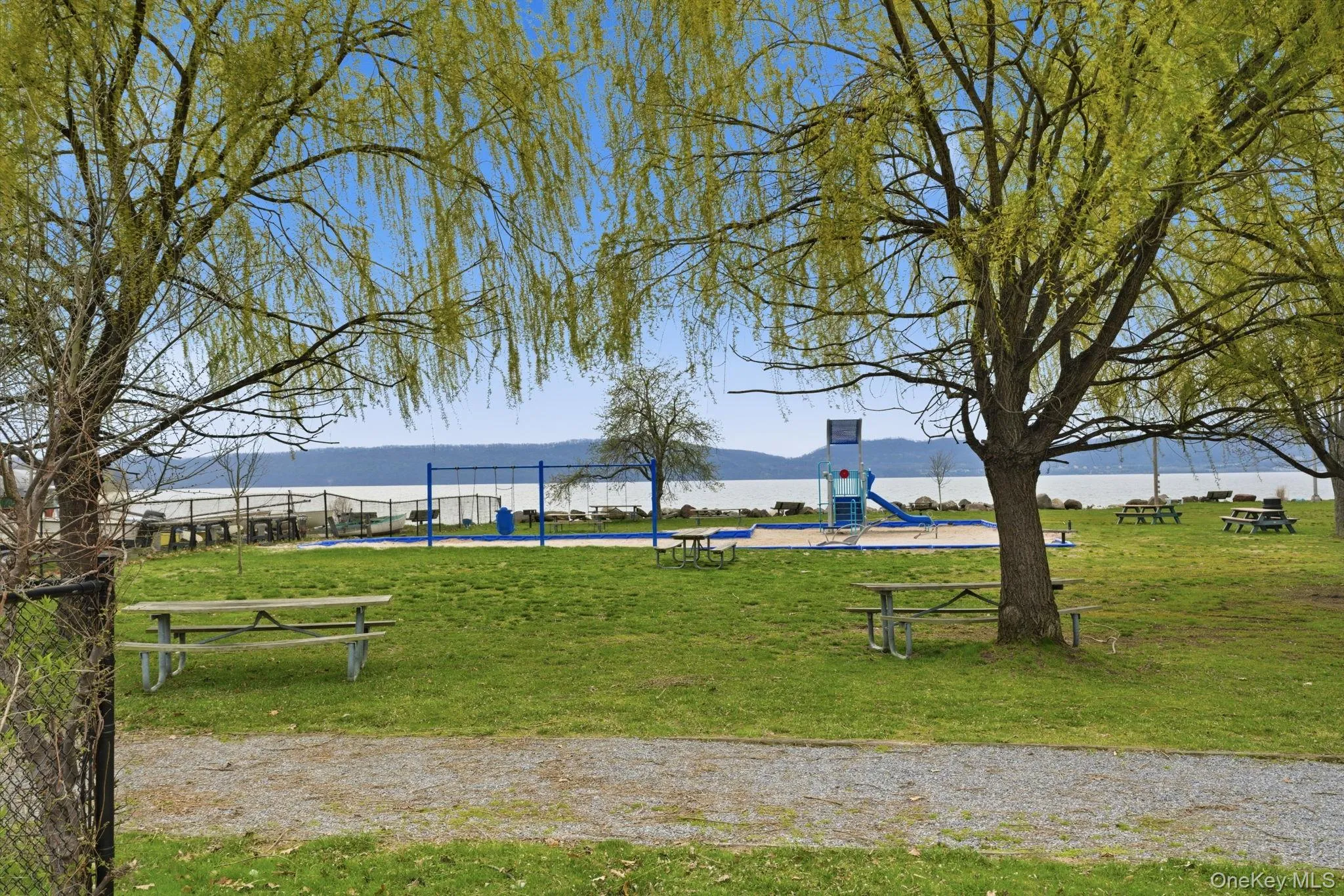 Beautiful nearby park setting with walking paths, mature trees, and direct water views, perfect for outdoor enjoyment. Beautiful nearby park setting with walking paths, mature trees, and direct water views, perfect for outdoor enjoyment.