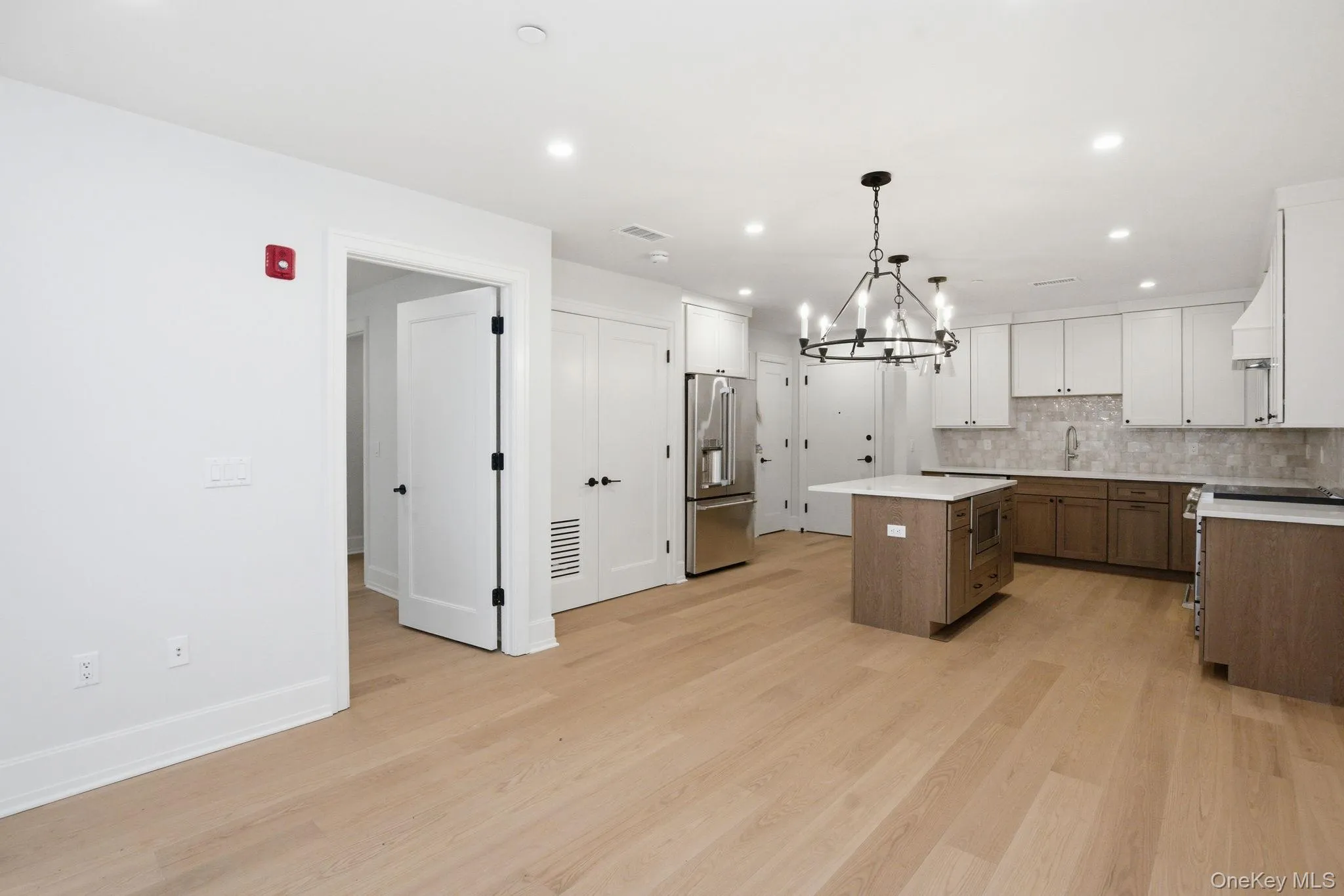 Spacious open living environment with a cohesive design that connects interior living areas to the outdoor patio for an extended living experience. Spacious open living environment with a cohesive design that connects interior living areas to the outdoor patio for an extended living experience.