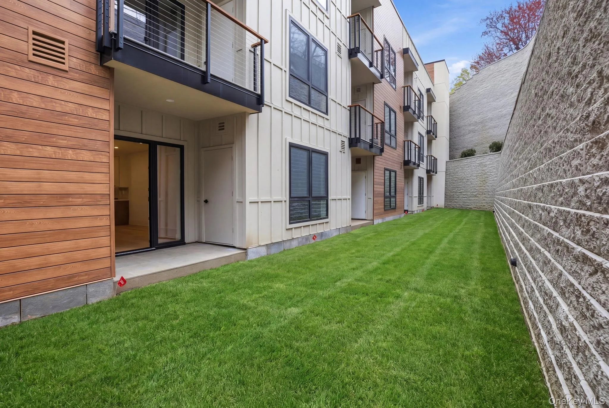 Private patio extends the living space outdoors, offering a seamless connection to a landscaped setting. Private patio extends the living space outdoors, offering a seamless connection to a landscaped setting.