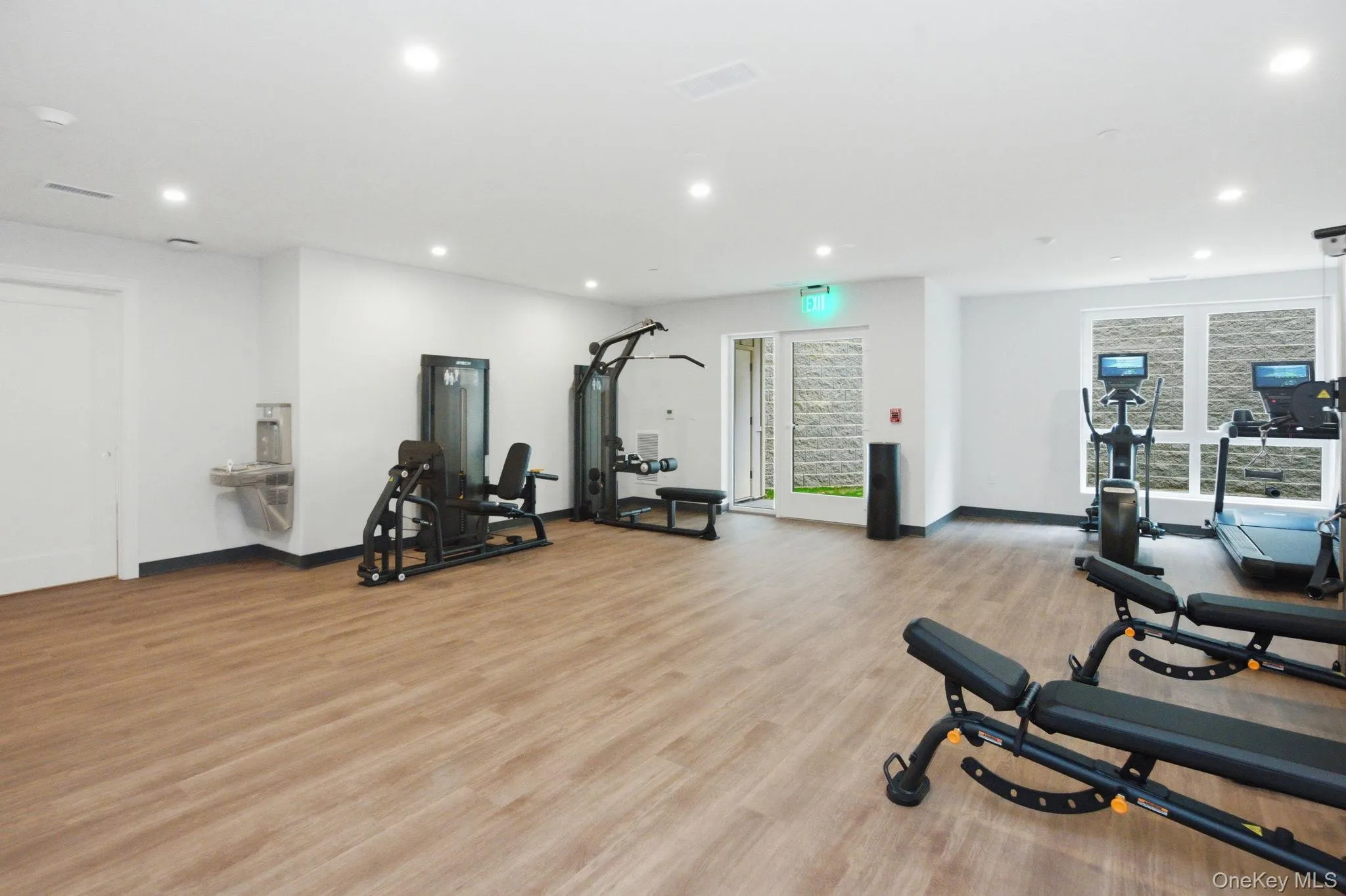 Light-filled fitness center at 25 S Riverside Avenue, featuring dedicated space for strength training and cardio just steps from your residence. Light-filled fitness center at 25 S Riverside Avenue, featuring dedicated space for strength training and cardio just steps from your residence.