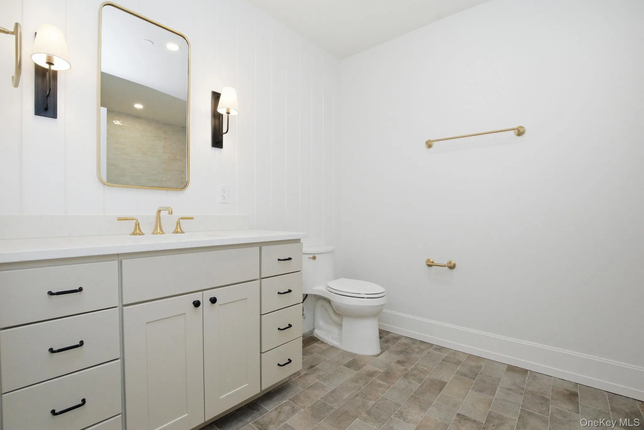 Clean, modern bath design highlighted by elegant lighting, refined finishes, and a thoughtfully designed vanity space. Clean, modern bath design highlighted by elegant lighting, refined finishes, and a thoughtfully designed vanity space.