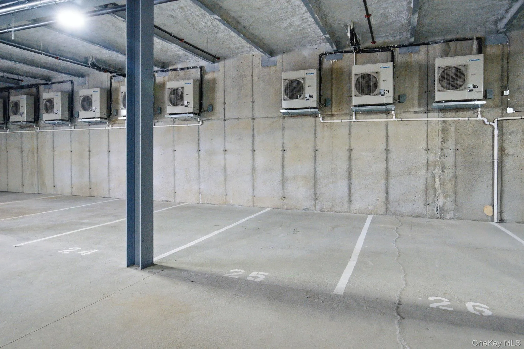 Deeded garage parking provides secure, covered access with clearly designated spaces for added convenience. Deeded garage parking provides secure, covered access with clearly designated spaces for added convenience.