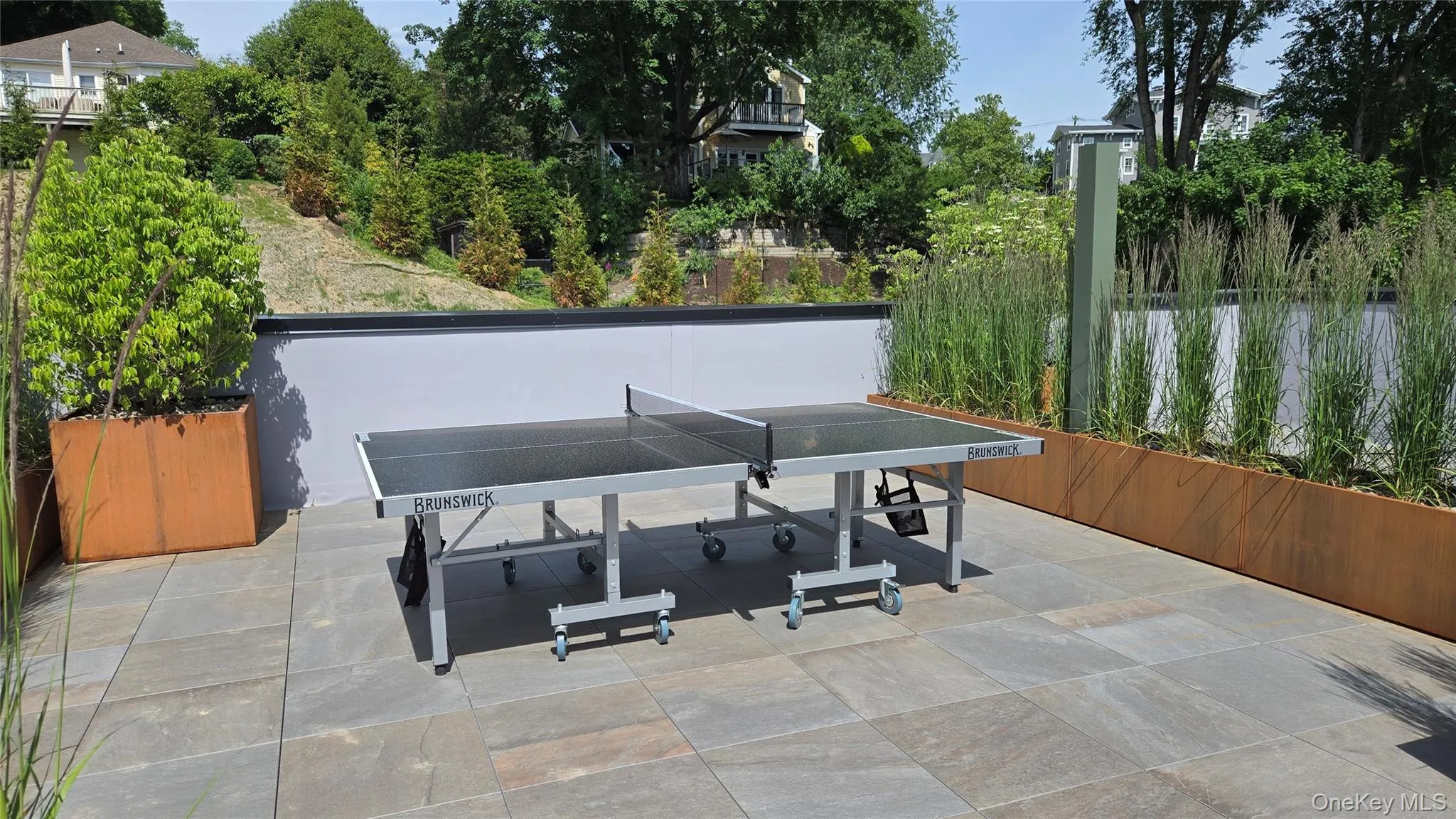 A dedicated game area with outdoor table tennis rounds out the rooftop amenities. A dedicated game area with outdoor table tennis rounds out the rooftop amenities.