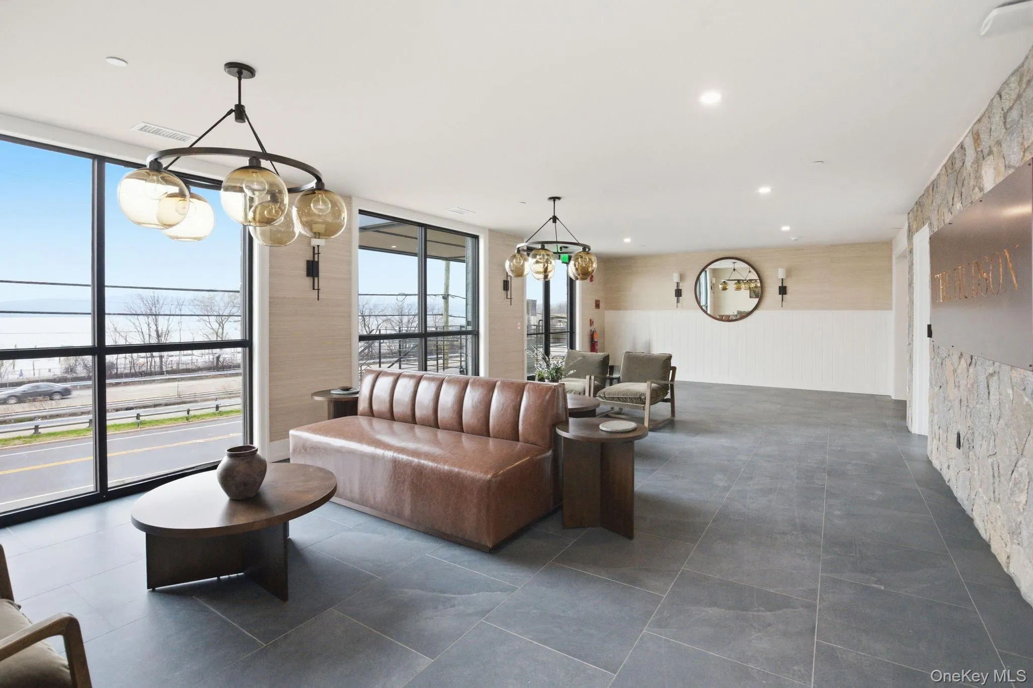The welcoming lobby at The Hudson, where designer finishes and thoughtful details set the tone for the refined living experience within. The welcoming lobby at The Hudson, where designer finishes and thoughtful details set the tone for the refined living experience within.