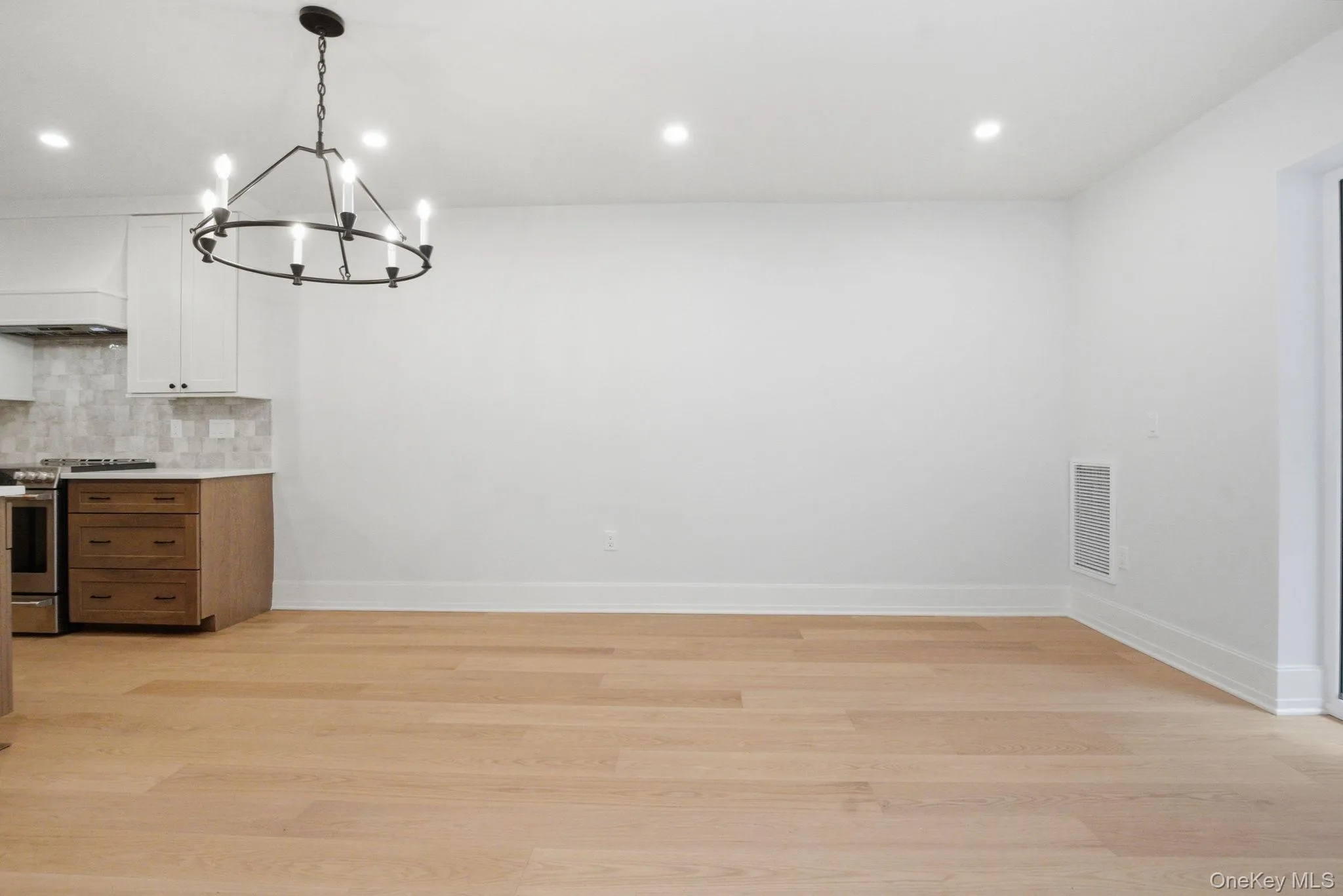 Light-filled living area featuring clean architectural lines and a flexible layout to accommodate a variety of living and dining configurations. Light-filled living area featuring clean architectural lines and a flexible layout to accommodate a variety of living and dining configurations.