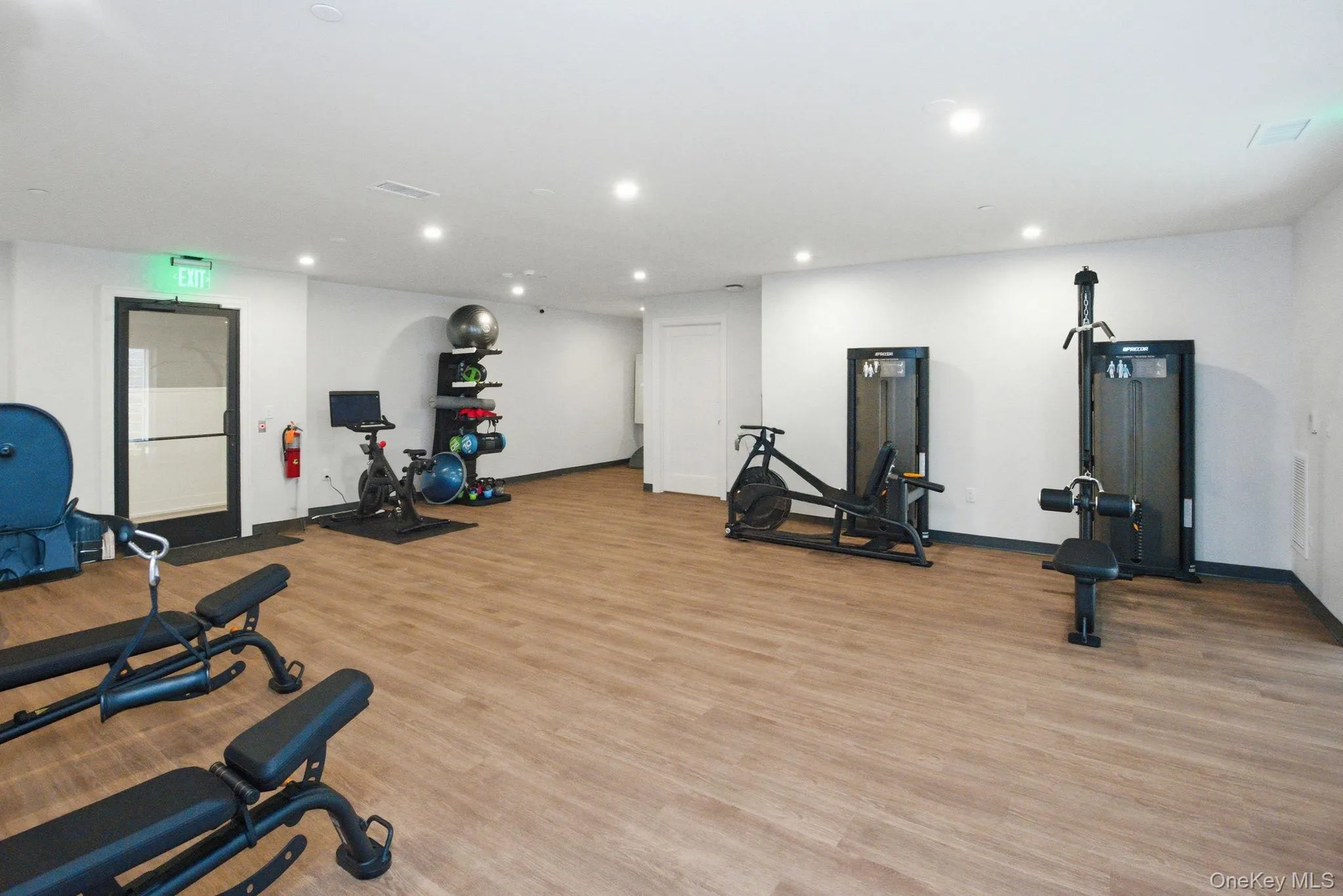 Fully equipped fitness center at The Hudson, offering a curated mix of strength and cardio equipment within a clean, modern setting designed for everyday wellness. Fully equipped fitness center at The Hudson, offering a curated mix of strength and cardio equipment within a clean, modern setting designed for everyday wellness.