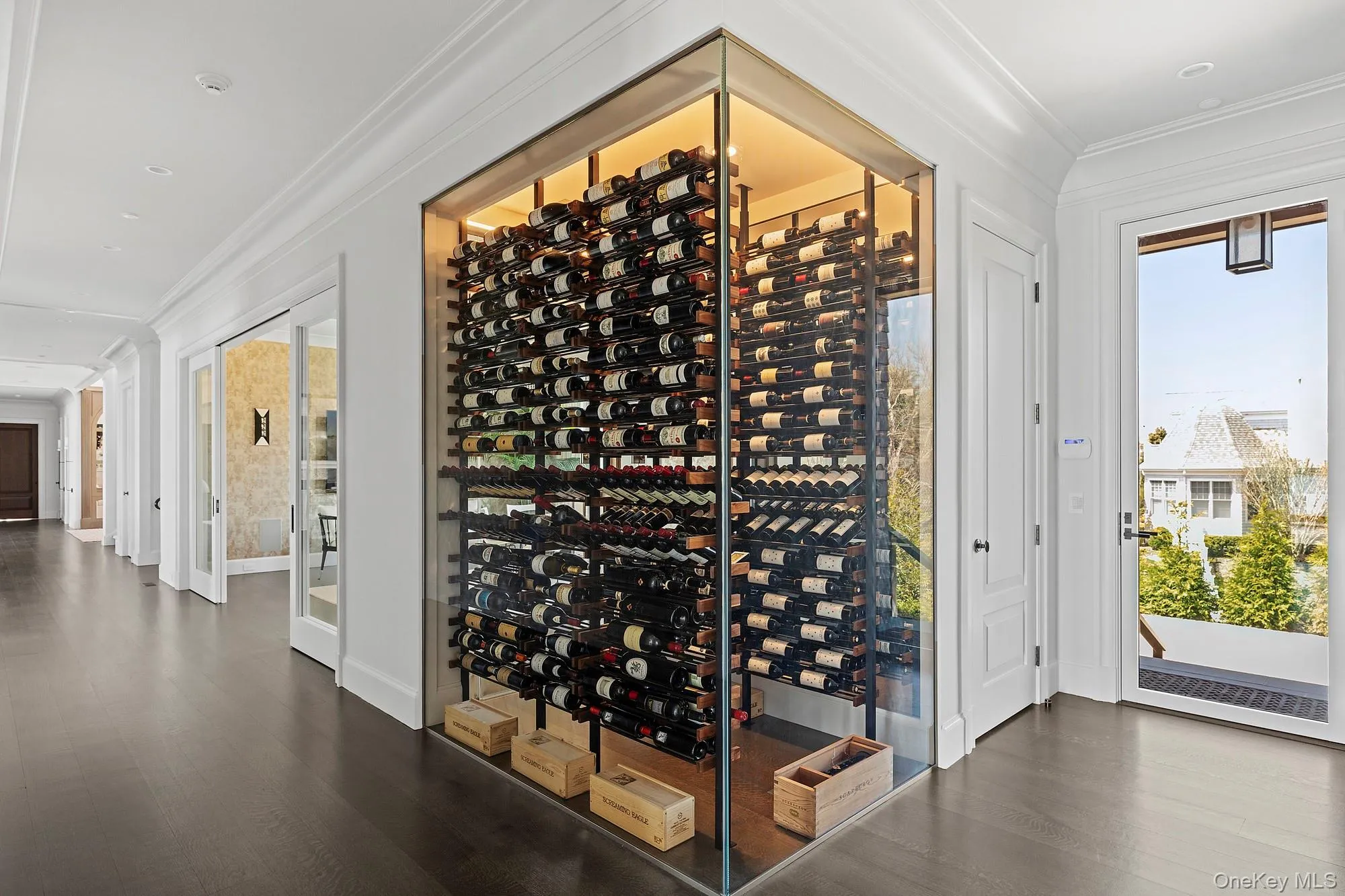 Wine cellar with wood finished floors, ornamental molding, and baseboards Wine cellar with wood finished floors, ornamental molding, and baseboards