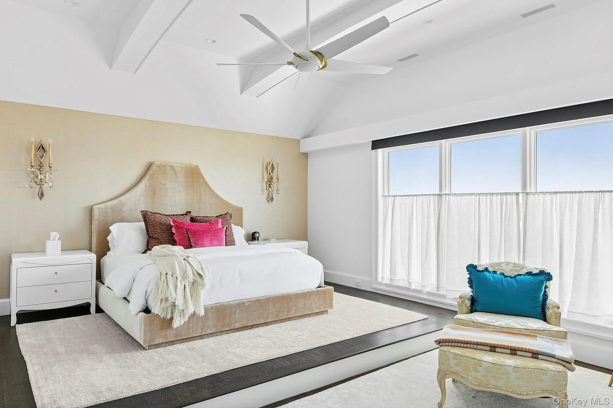Bedroom featuring lofted ceiling, baseboards, wood finished floors, and ceiling fan Bedroom featuring lofted ceiling, baseboards, wood finished floors, and ceiling fan