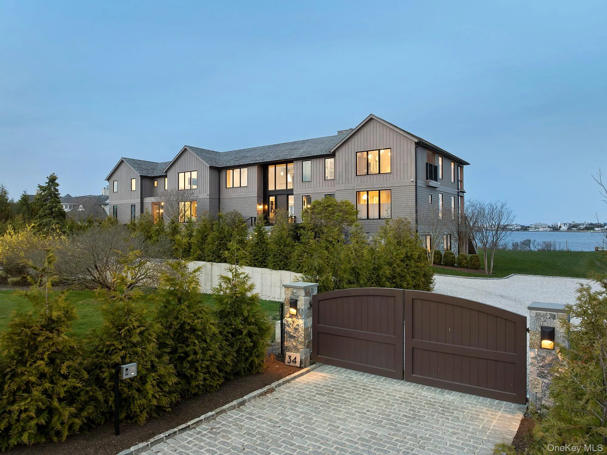 View of front of property featuring a gate and board and batten siding View of front of property featuring a gate and board and batten siding