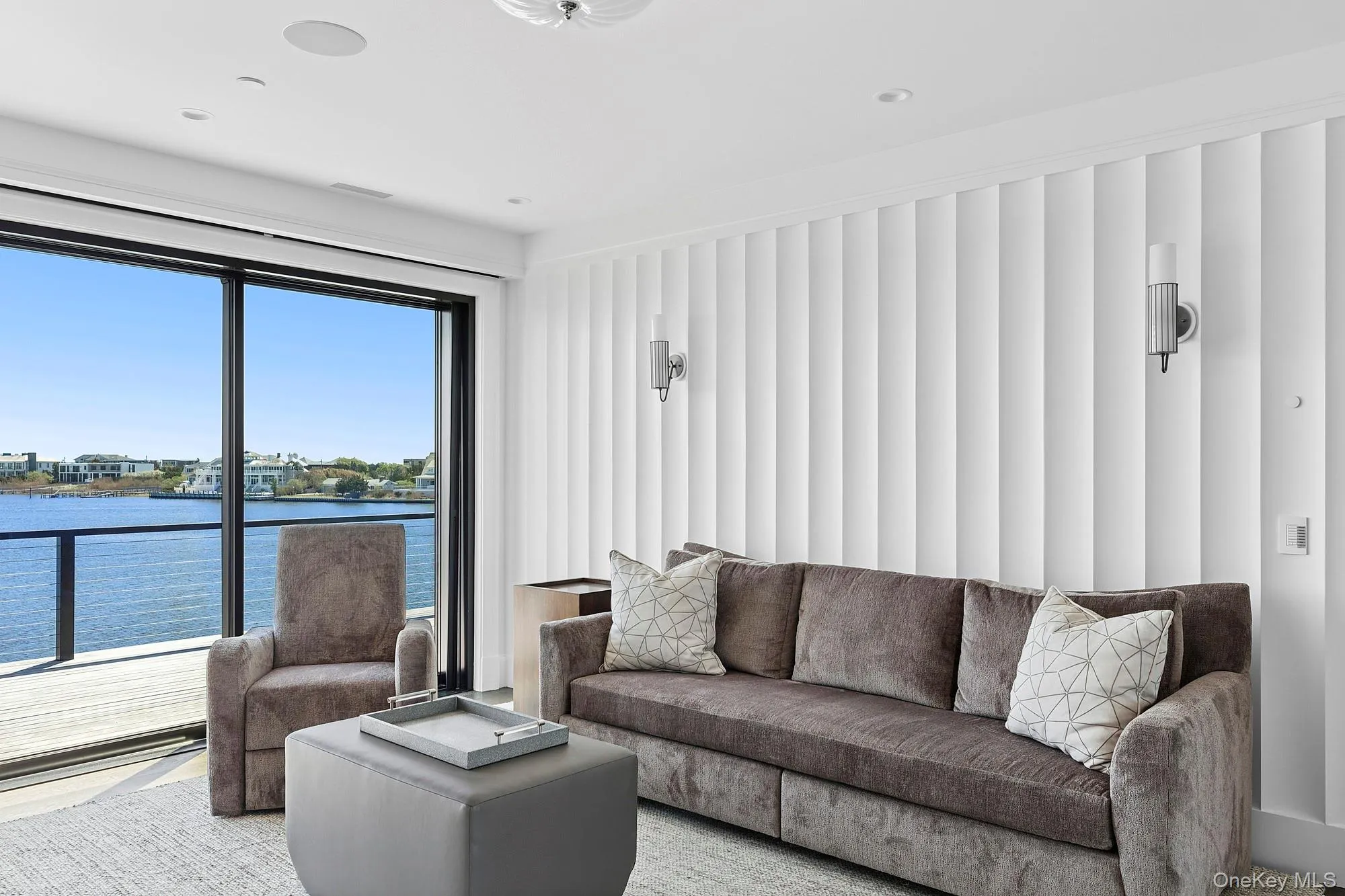 Living room featuring a water view Living room featuring a water view