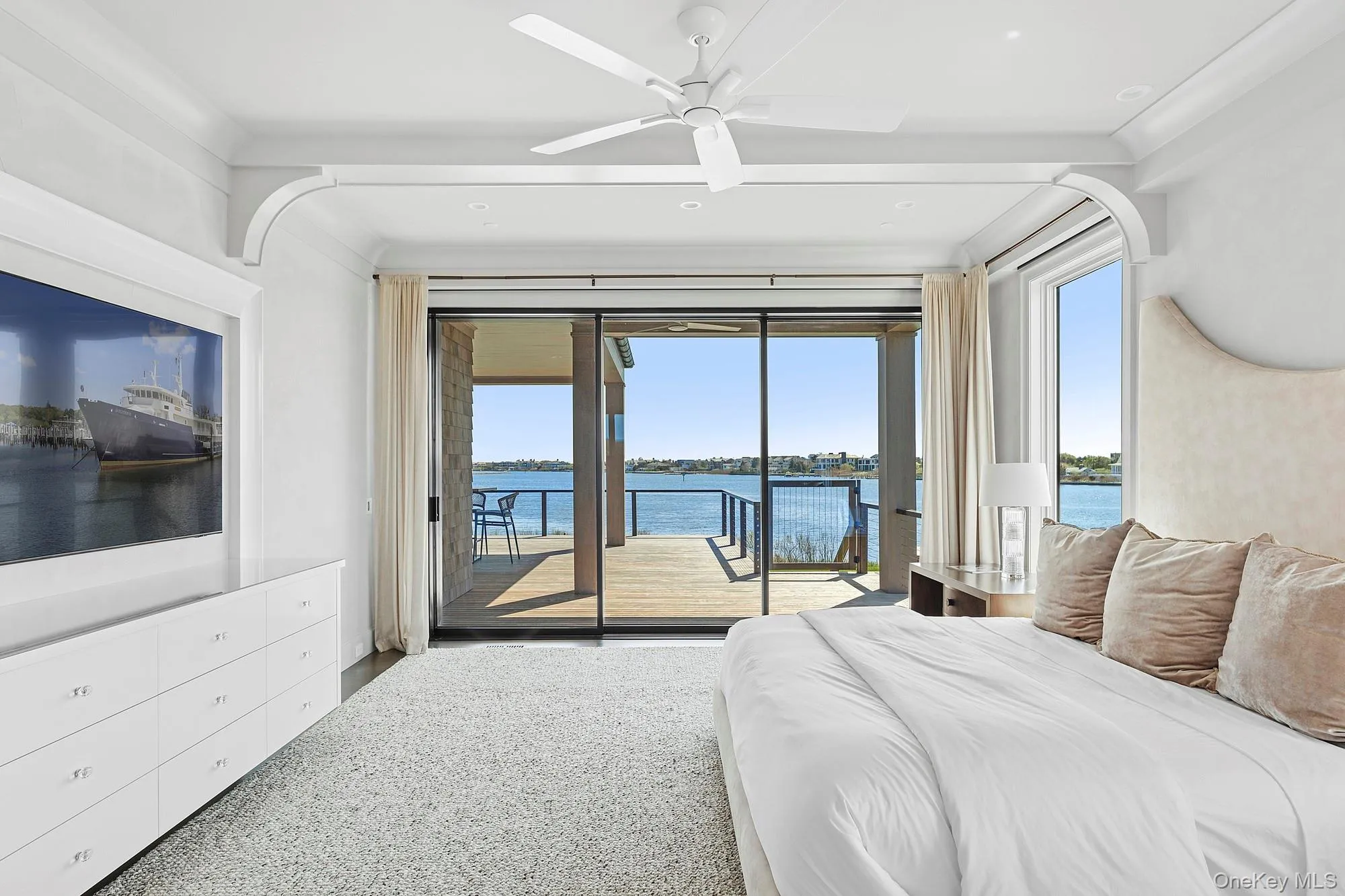 Bedroom featuring access to exterior, a water view, recessed lighting, and ceiling fan Bedroom featuring access to exterior, a water view, recessed lighting, and ceiling fan