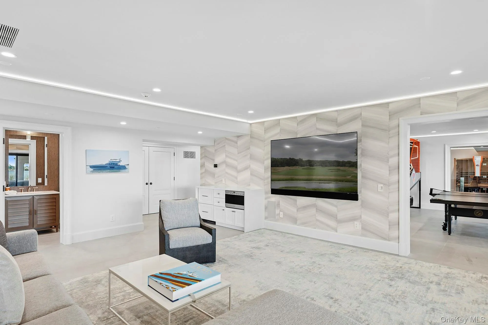 Unfurnished living room featuring recessed lighting, concrete floors, and baseboards Unfurnished living room featuring recessed lighting, concrete floors, and baseboards