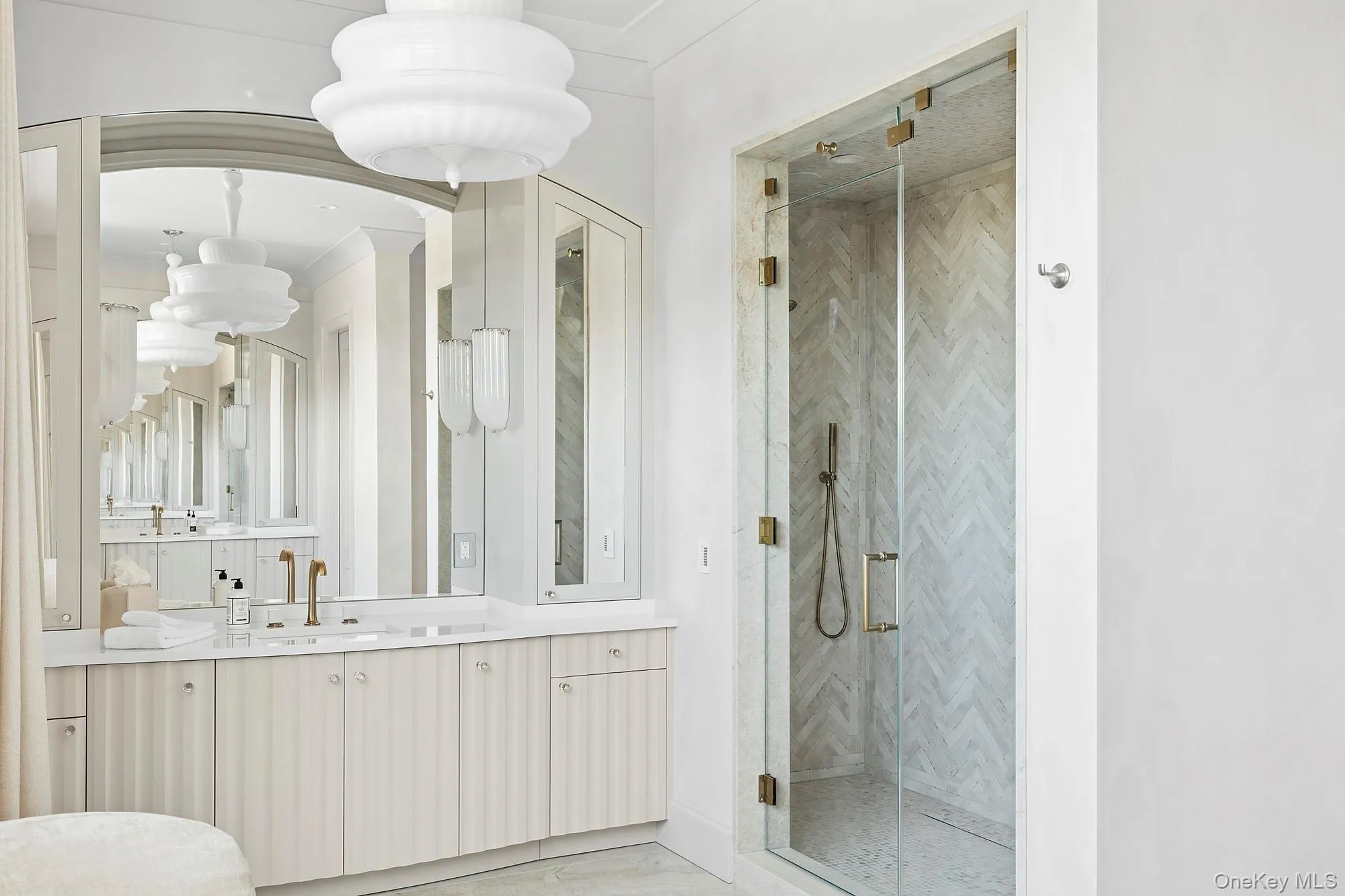 Bathroom featuring a stall shower and vanity Bathroom featuring a stall shower and vanity
