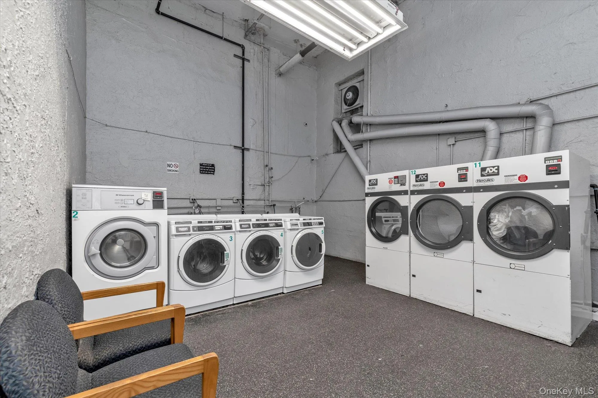 Community laundry with washing machine and clothes dryer Community laundry with washing machine and clothes dryer