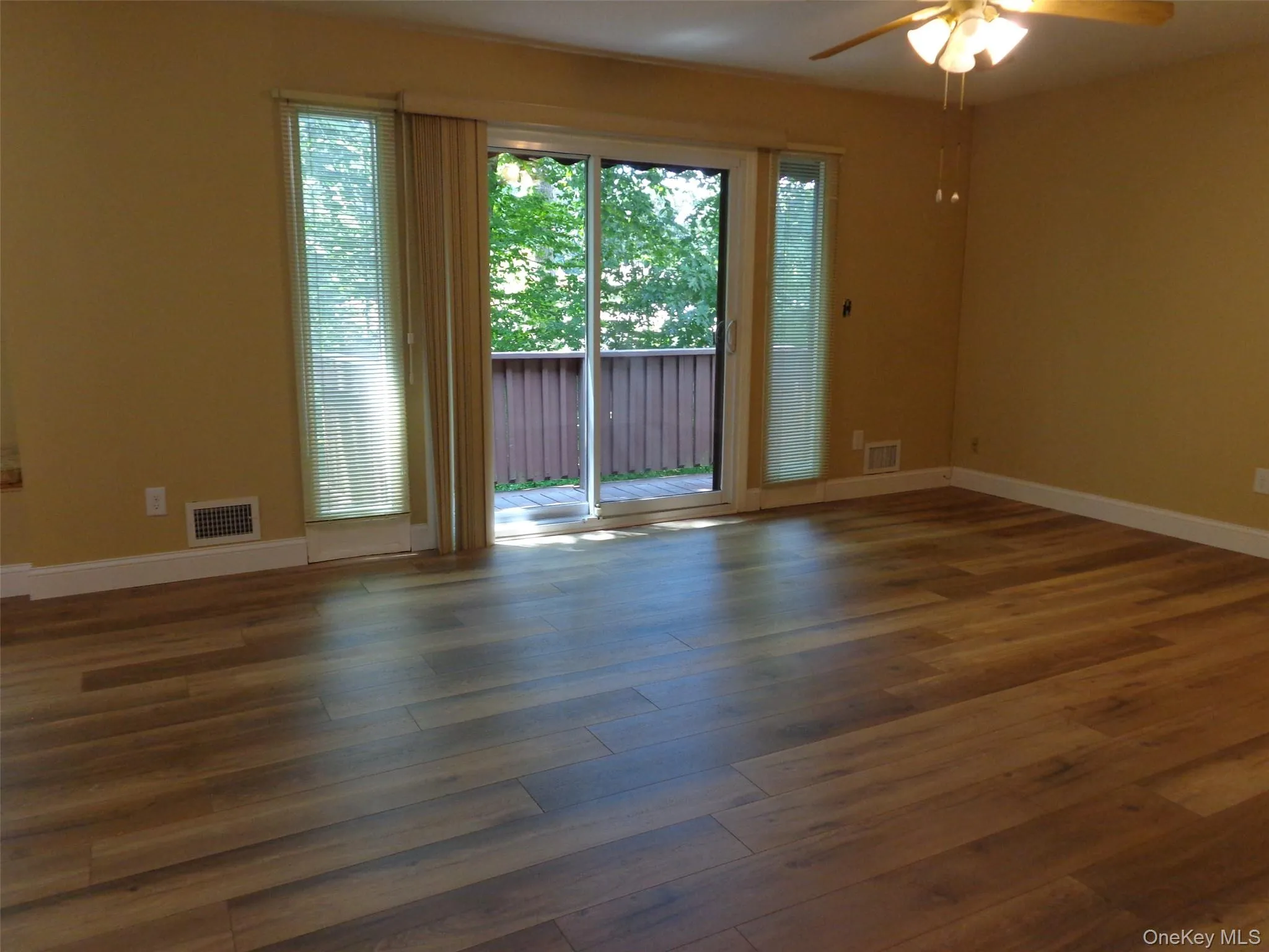 New flooring and baseboard trim throughout. Sliding glass door leads out to your private deck and treed yard. New flooring and baseboard trim throughout. Sliding glass door leads out to your private deck and treed yard.