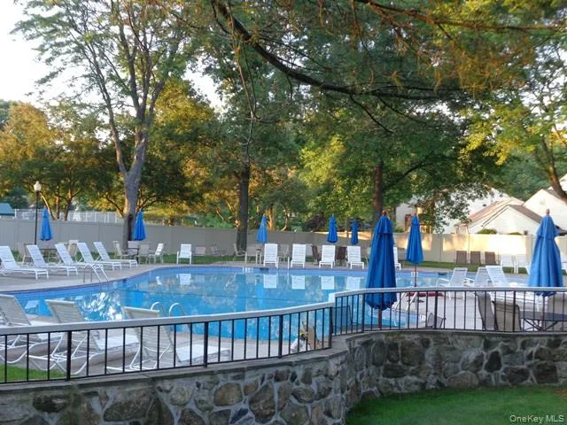 Privately set inground pool, with plenty of tables and lounge chairs. Privately set inground pool, with plenty of tables and lounge chairs.