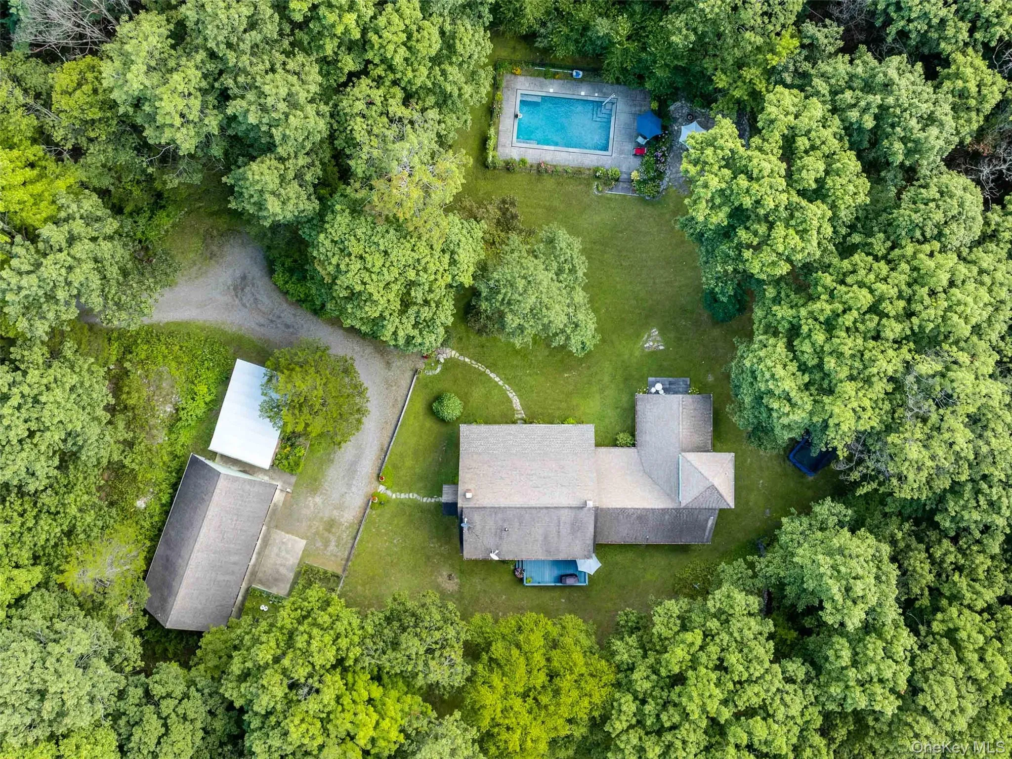 Aerial view of property's location with a pool area Aerial view of property's location with a pool area