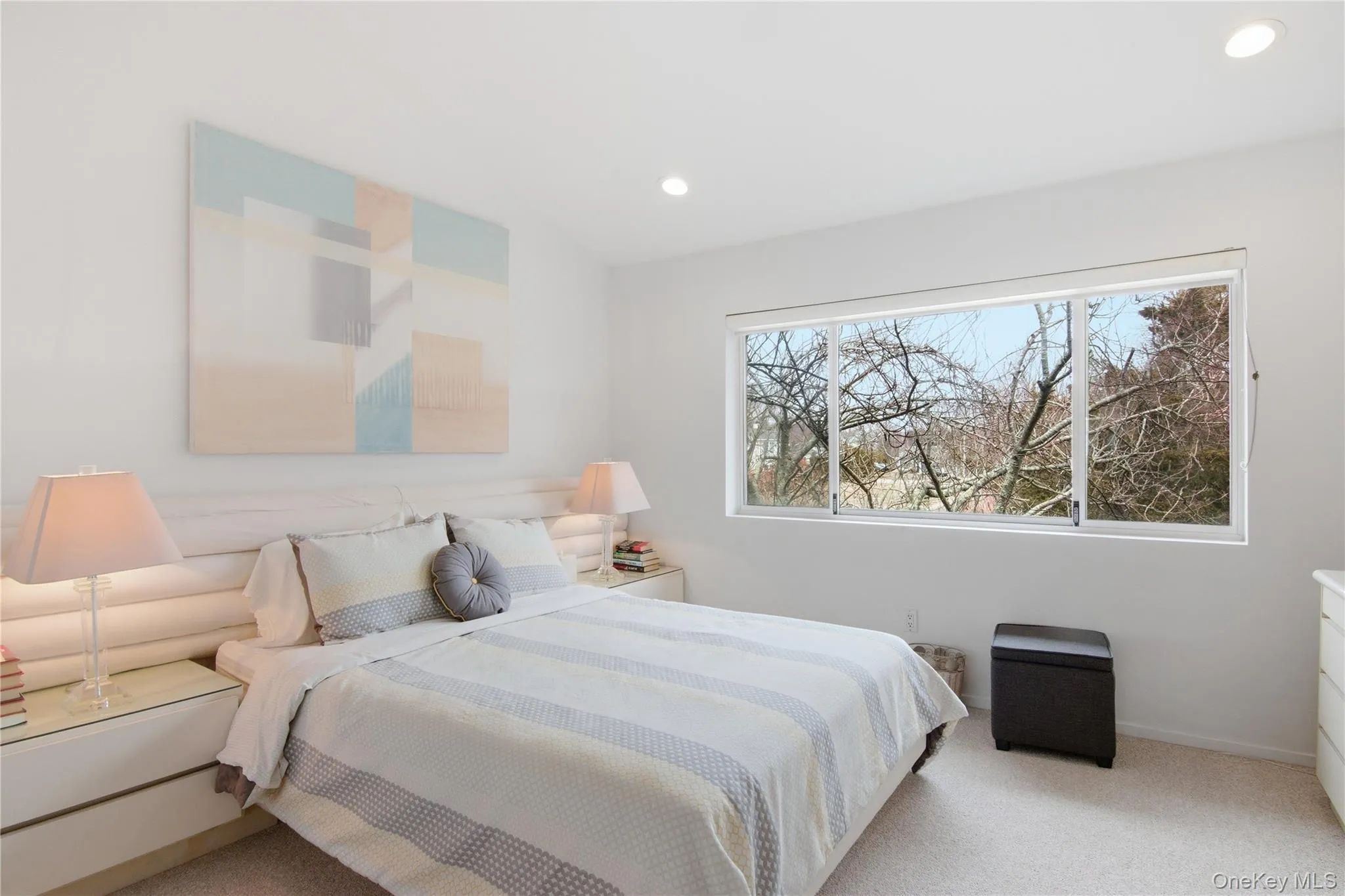 Bedroom featuring light carpet and recessed lighting Bedroom featuring light carpet and recessed lighting