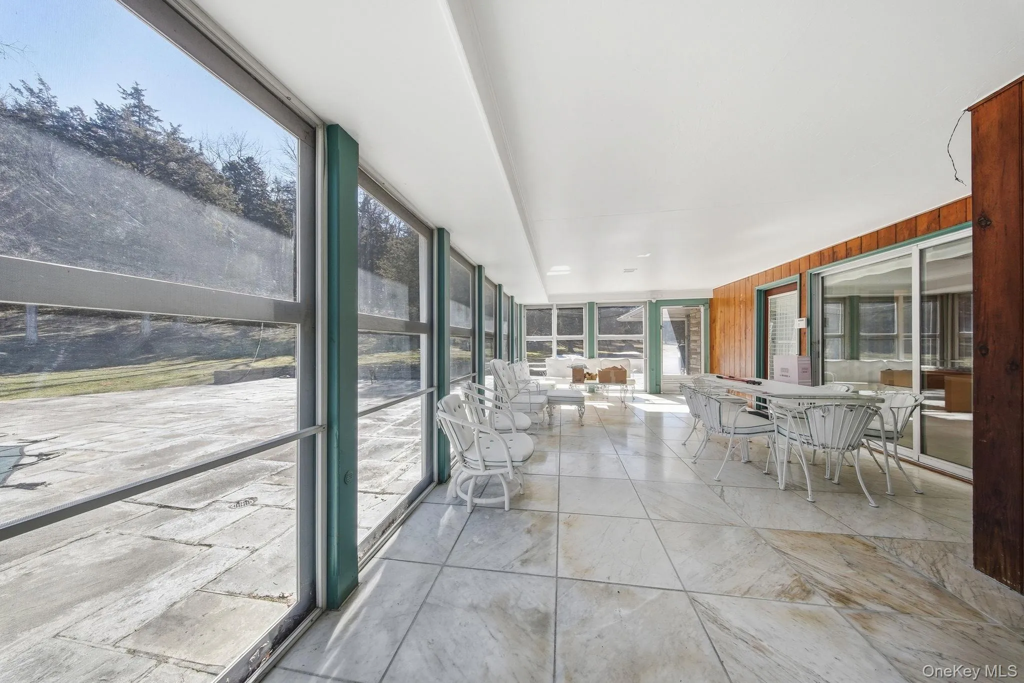 Sunroom with marble flooring Sunroom with marble flooring