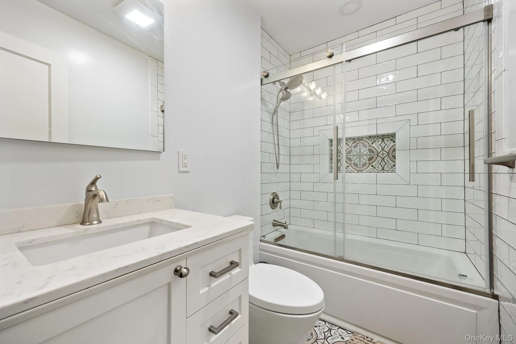Bathroom with enclosed tub / shower combo and vanity Bathroom with enclosed tub / shower combo and vanity