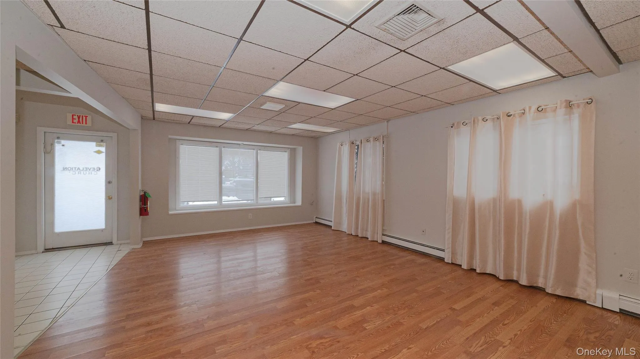 Entry into building view of open space perfect for show room or conference area. Entry into building view of open space perfect for show room or conference area.