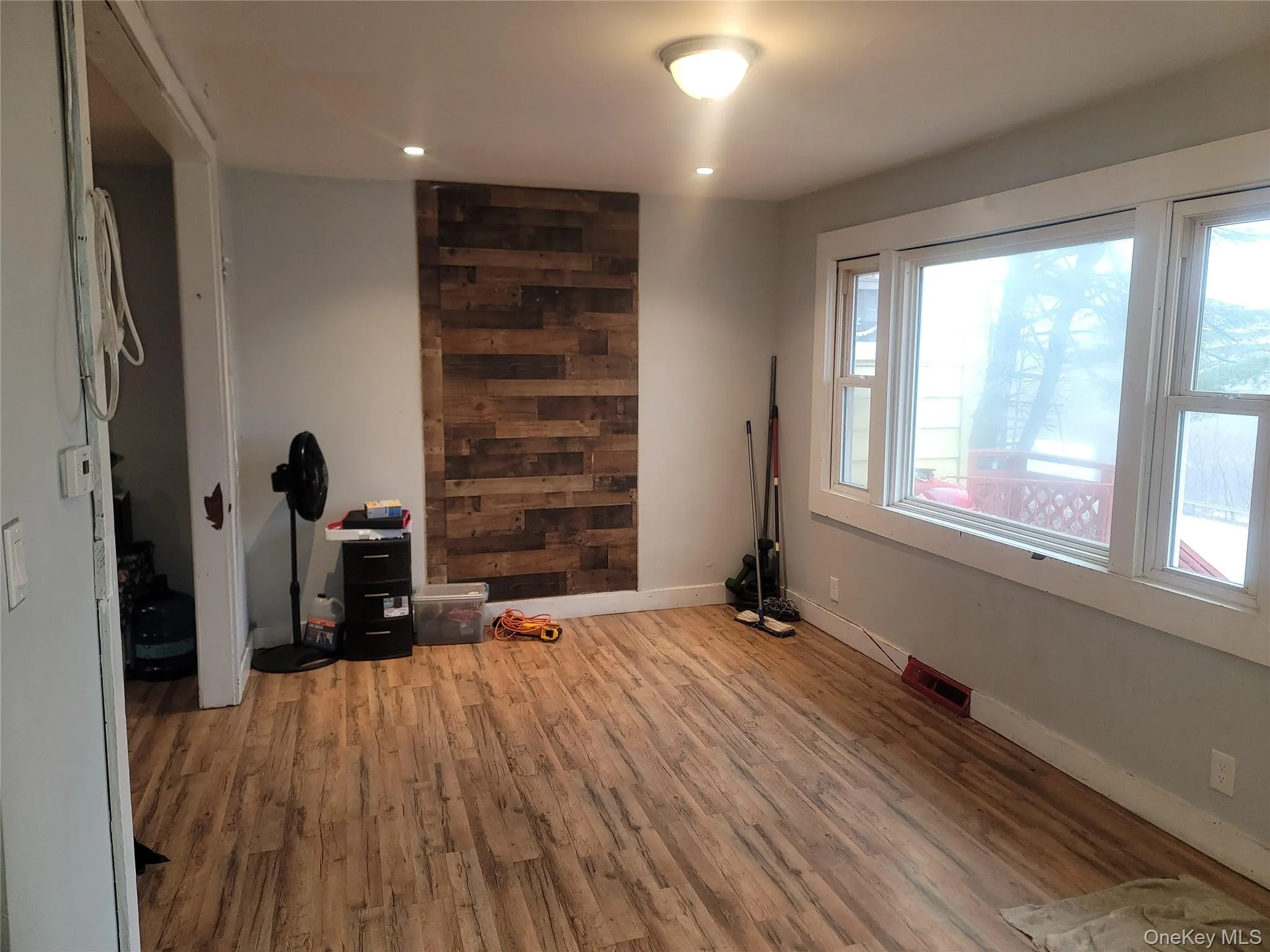 Empty room with light wood-style flooring and recessed lighting Empty room with light wood-style flooring and recessed lighting