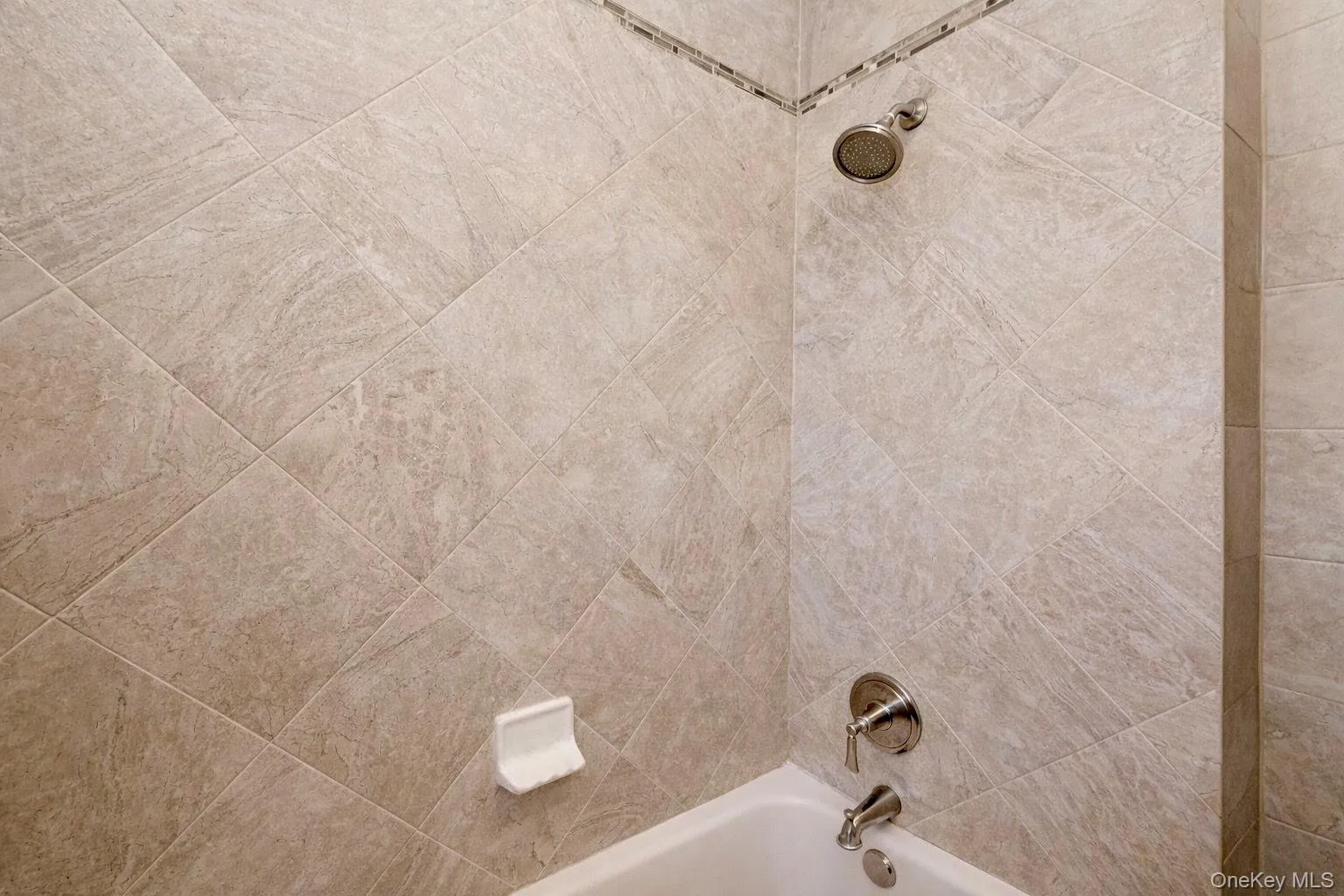 Bathroom with upgraded tile surround Bathroom with upgraded tile surround