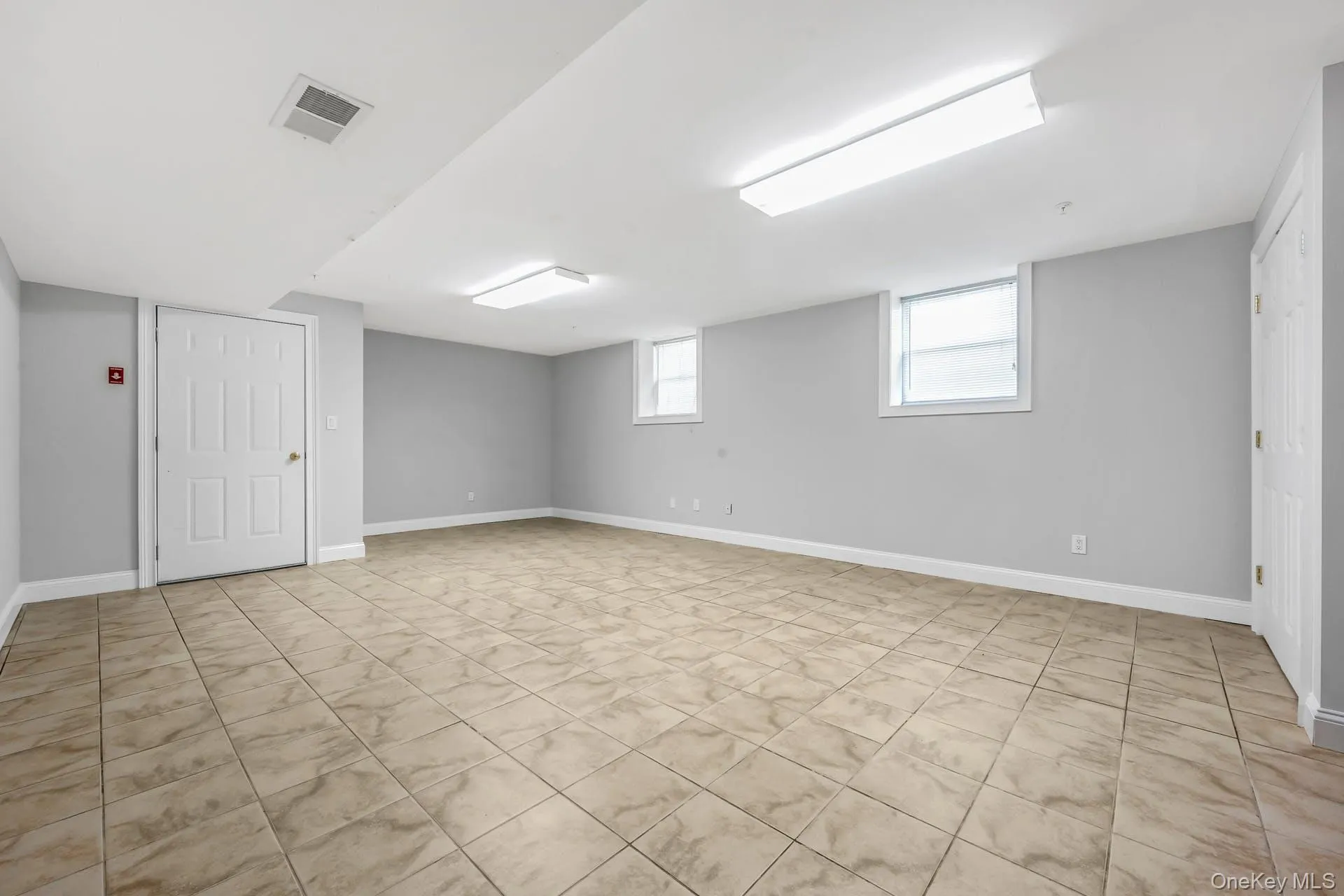 Basement featuring baseboards Basement featuring baseboards