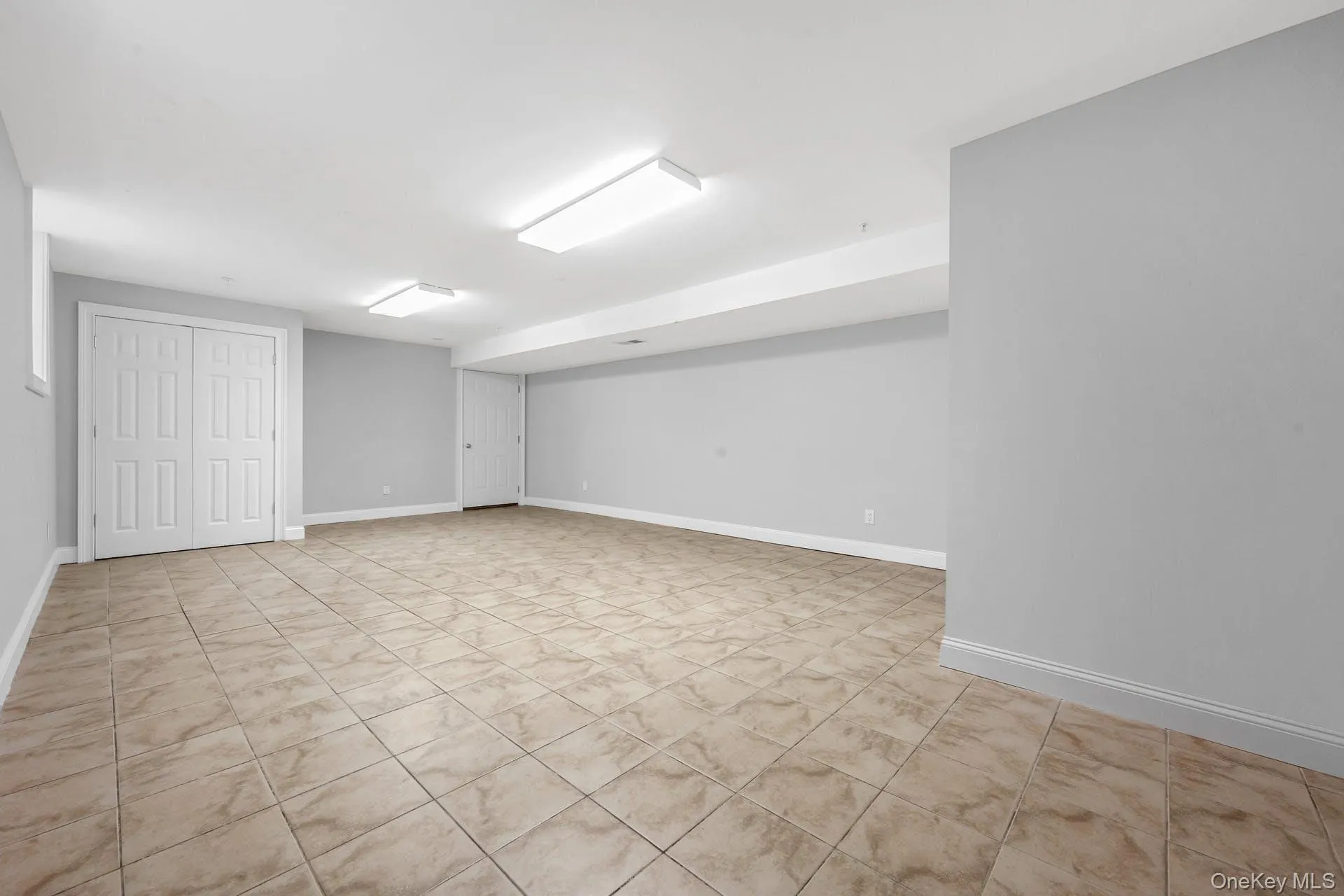 Finished below grade area featuring baseboards Finished below grade area featuring baseboards