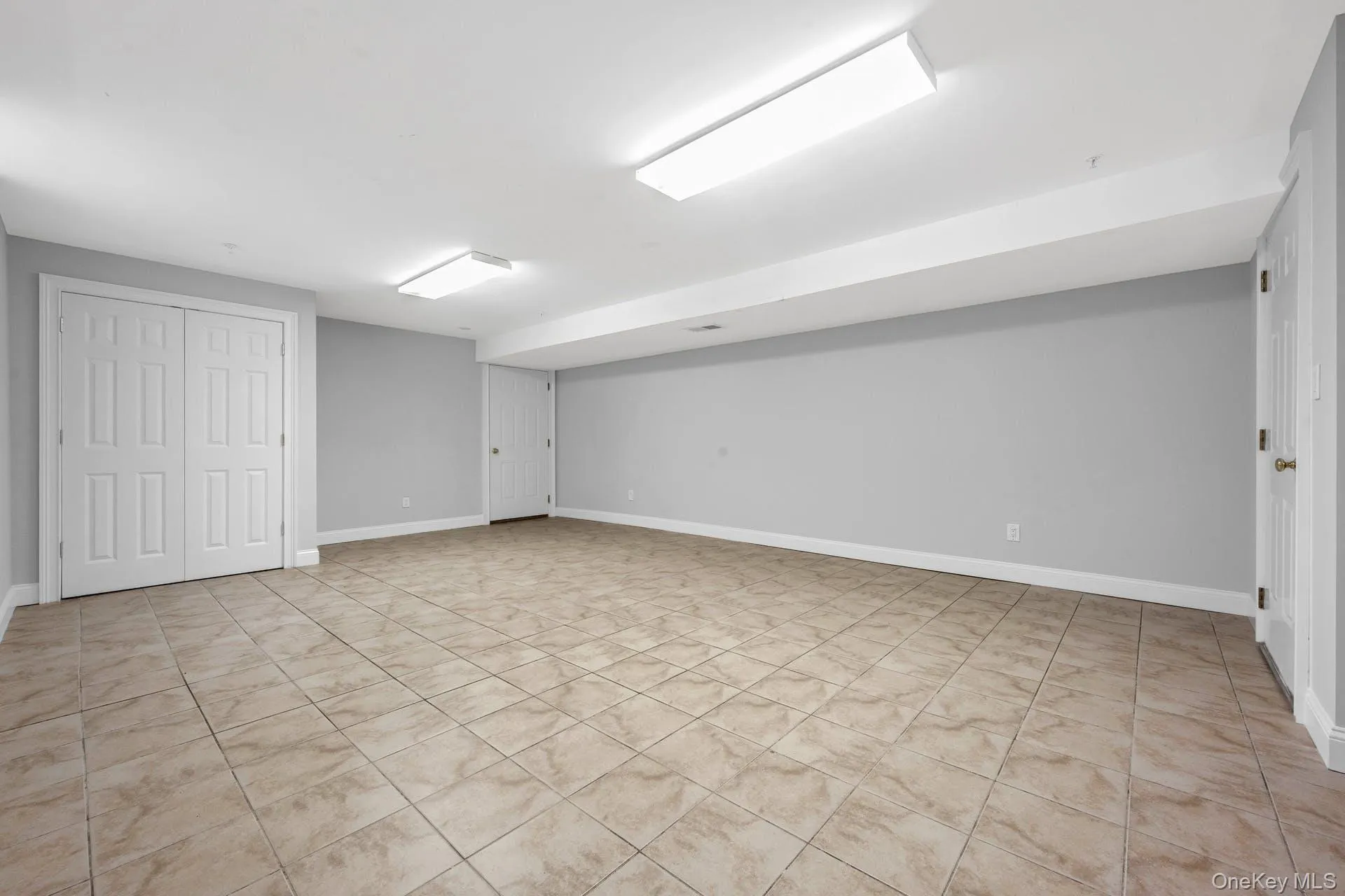 Finished below grade area featuring baseboards Finished below grade area featuring baseboards