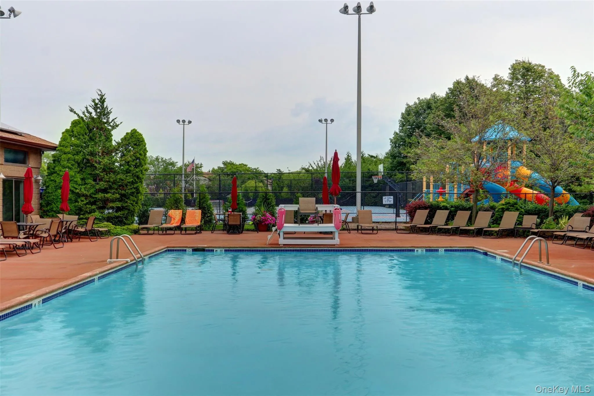 Community pool featuring a patio area Community pool featuring a patio area